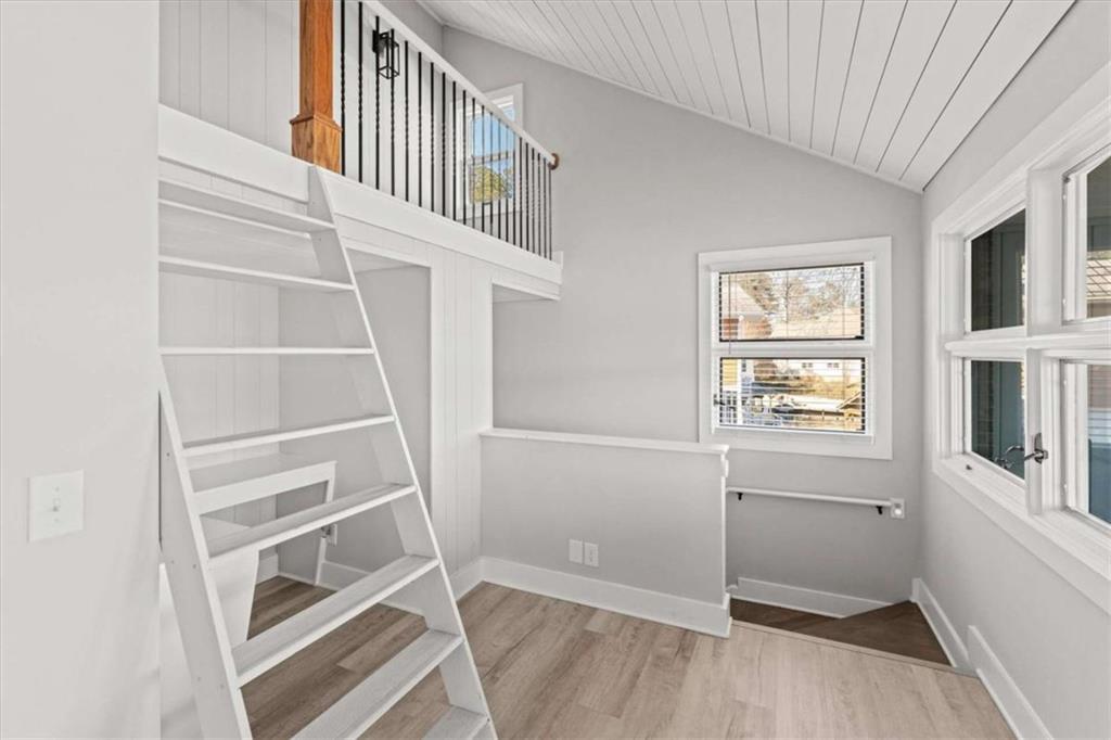 1127 Lakeshore Court Villa Rica, GA 30180 - Photo 37 of 86 a view of an empty room with wooden floor and a window