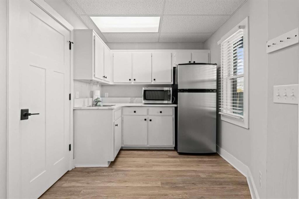 1127 Lakeshore Court Villa Rica, GA 30180 - Photo 41 of 86 a kitchen with cabinets stainless steel appliances and a refrigerator