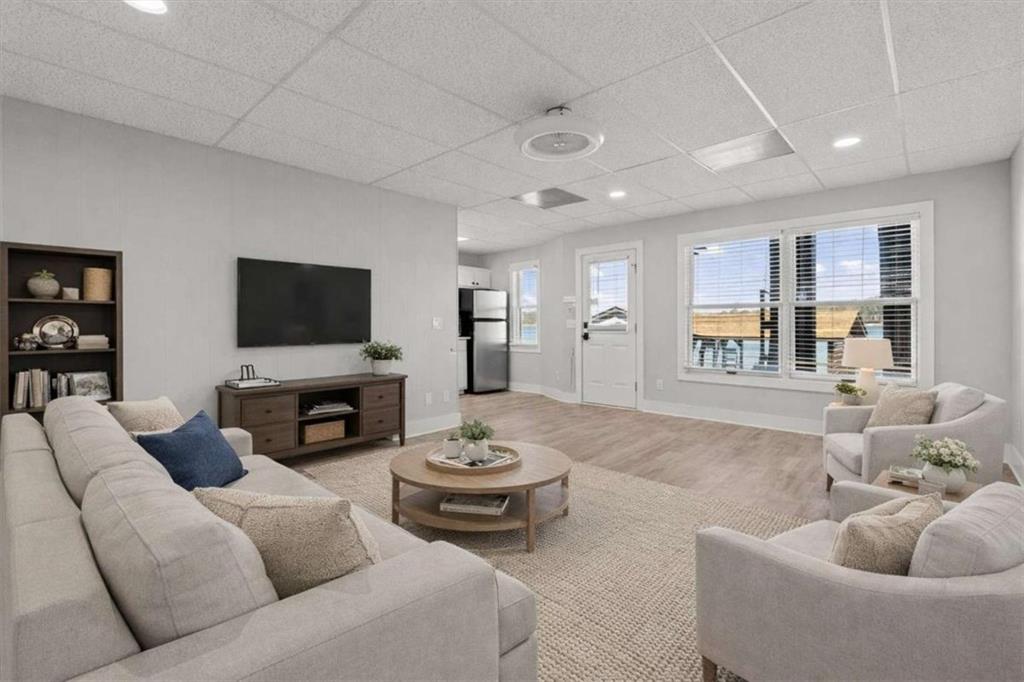 1127 Lakeshore Court Villa Rica, GA 30180 - Photo 42 of 86 a living room with furniture and a flat screen tv