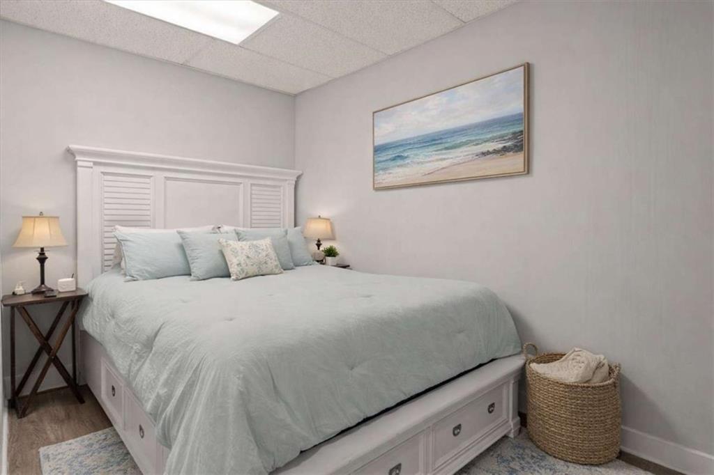 1127 Lakeshore Court Villa Rica, GA 30180 - Photo 49 of 86 a bedroom with a bed and lamp