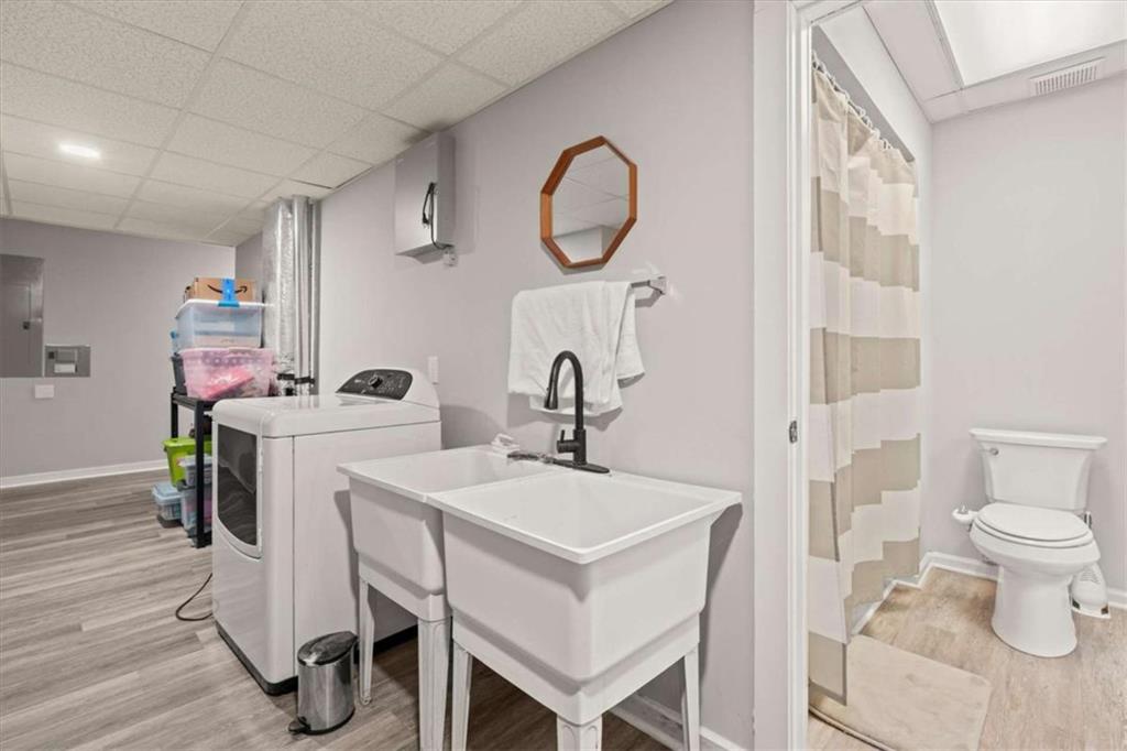 1127 Lakeshore Court Villa Rica, GA 30180 - Photo 50 of 86 a bathroom with a sink toilet and a mirror