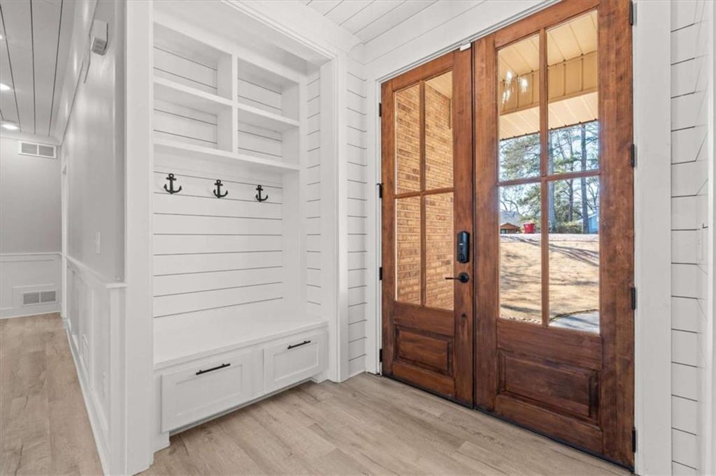 1127 Lakeshore Court Villa Rica, GA 30180 - Photo 5 of 86 a view of walk in closet with clothes and shoes