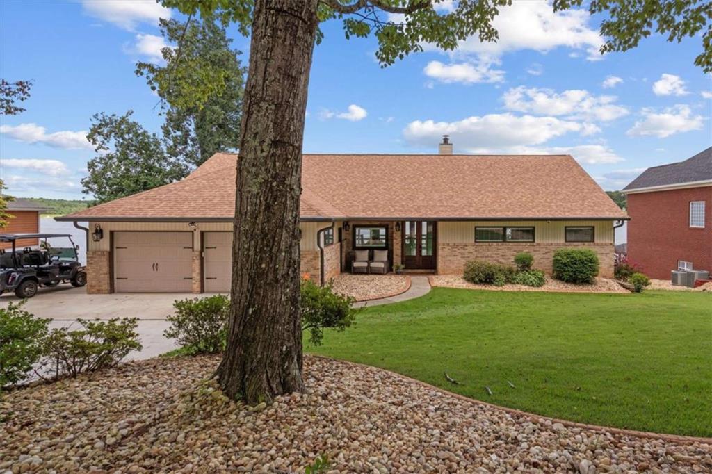 1127 Lakeshore Court Villa Rica, GA 30180 - Photo 52 of 86 a front view of a house with garden