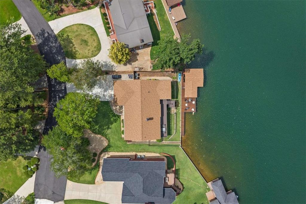 1127 Lakeshore Court Villa Rica, GA 30180 - Photo 61 of 86 an aerial view of a house with a yard and garden space