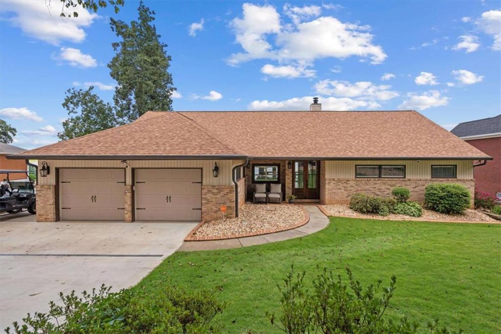 1127 Lakeshore Court Villa Rica, GA 30180 - Photo 86 of 86 a front view of a house with a yard and garage