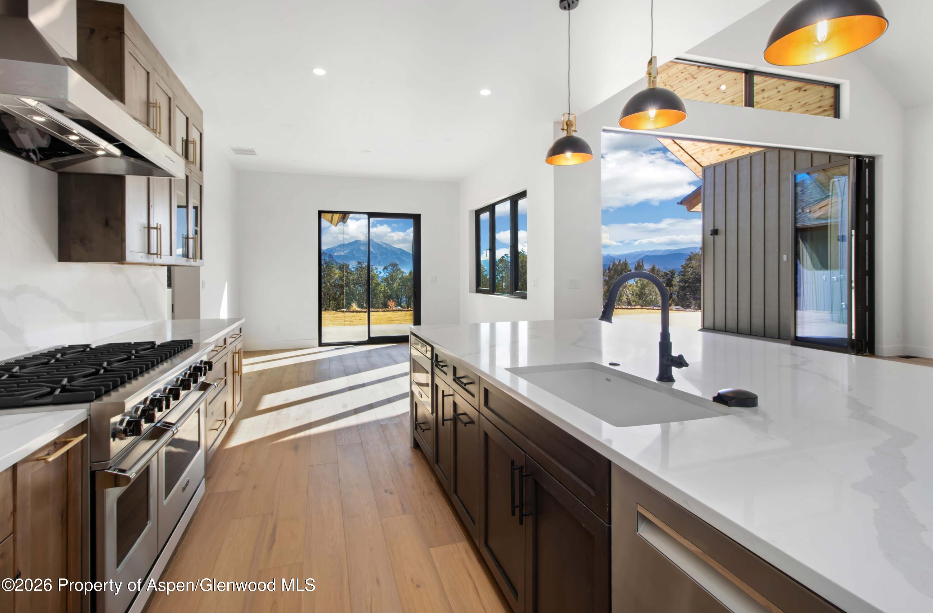 38 Woodruff Road Glenwood Springs, CO 81601 - Photo 11 of 34 a kitchen with a sink stove and microwave