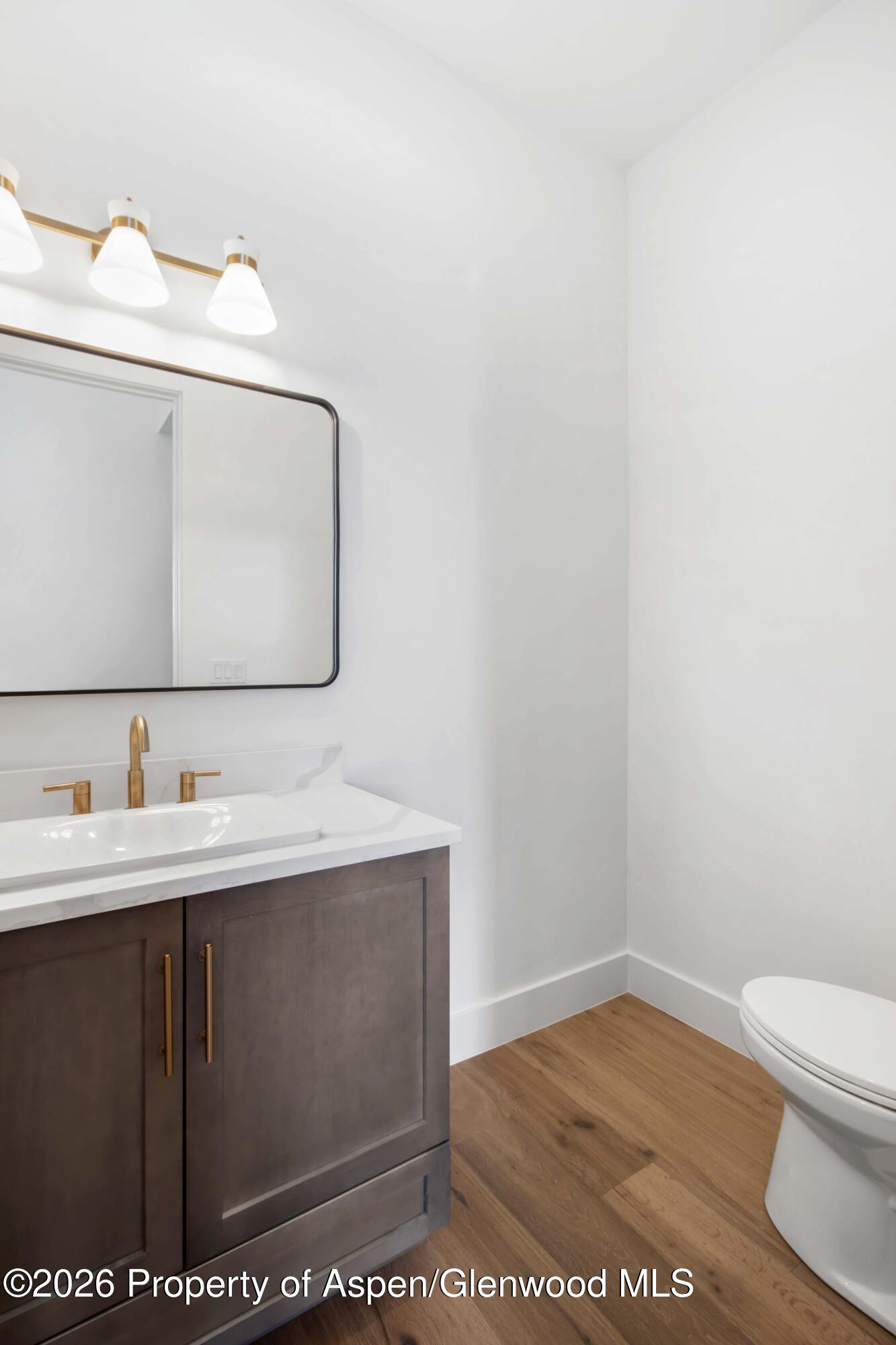 38 Woodruff Road Glenwood Springs, CO 81601 - Photo 16 of 34 a bathroom with a sink a toilet and mirror