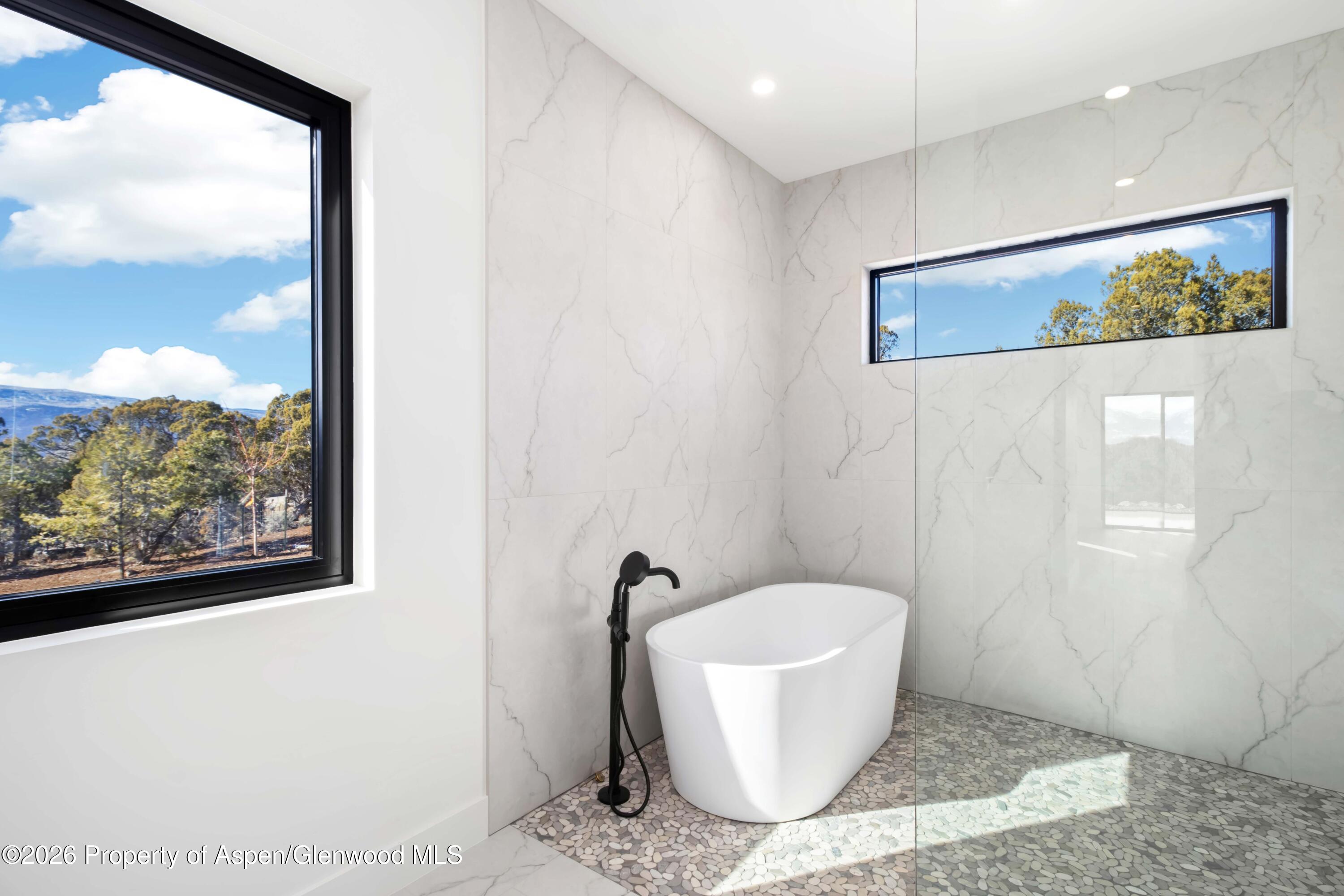 38 Woodruff Road Glenwood Springs, CO 81601 - Photo 21 of 34 a bathroom with a granite countertop sink and a mirror