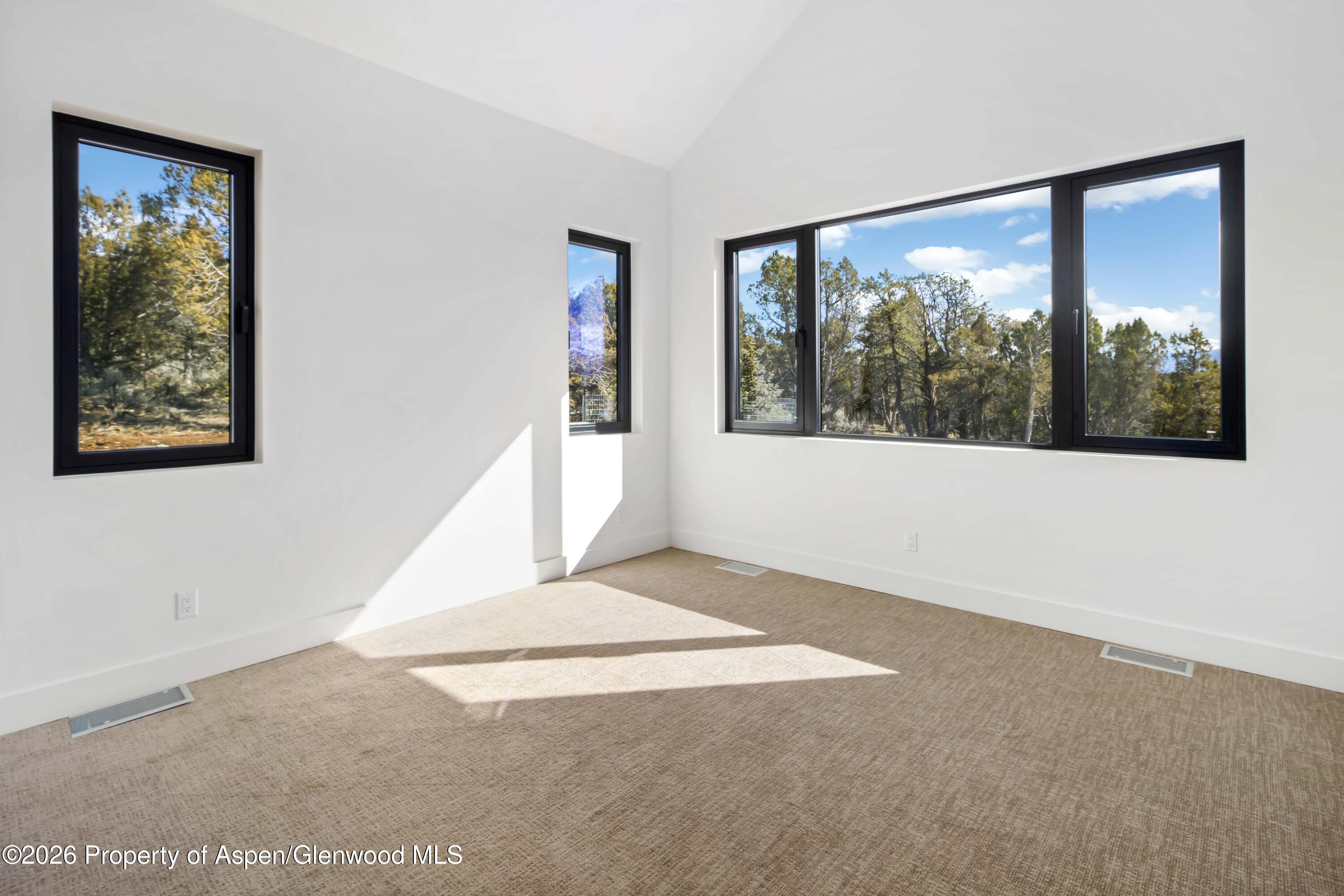 38 Woodruff Road Glenwood Springs, CO 81601 - Photo 22 of 34 a view of an empty room with a window
