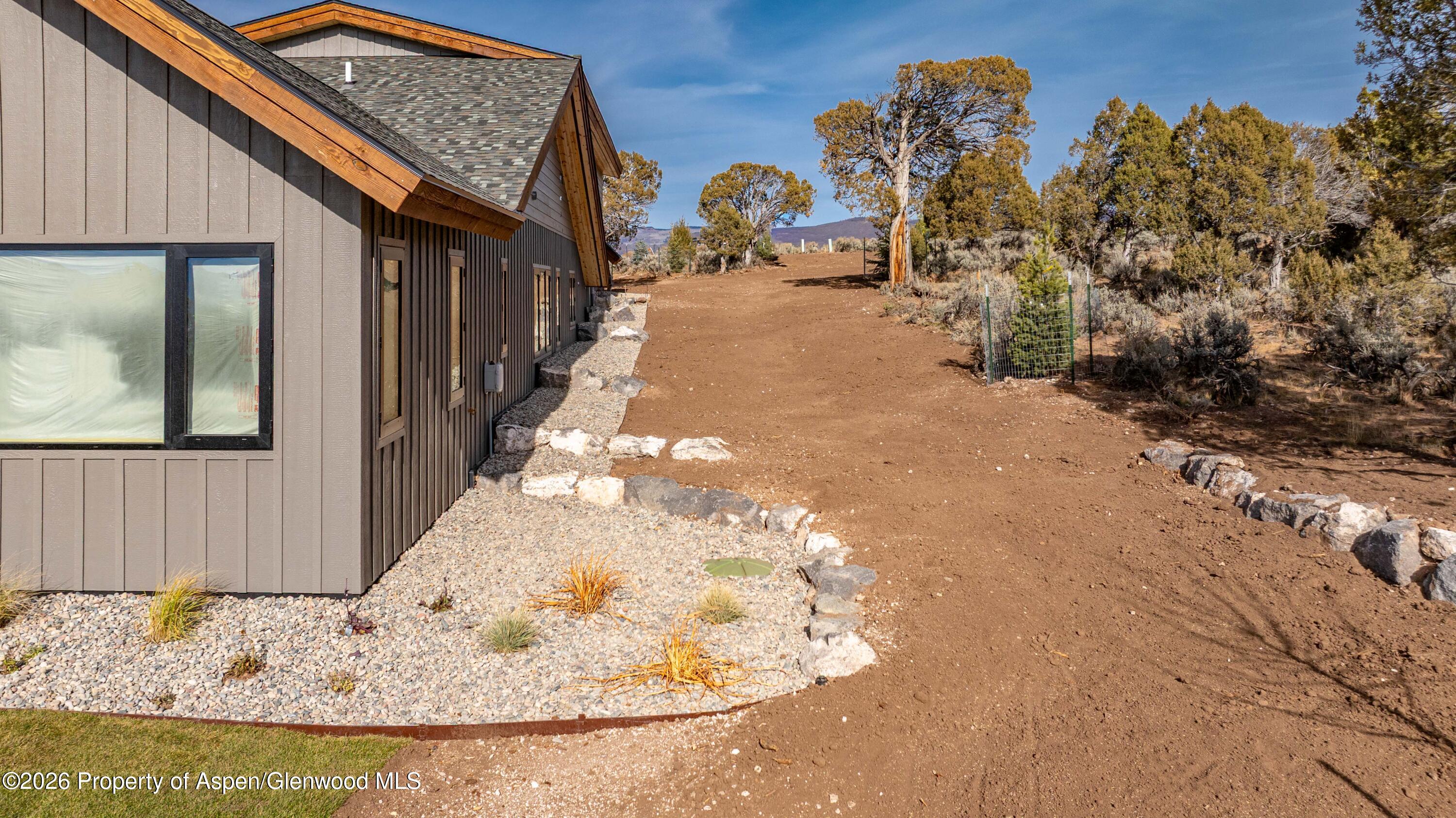 38 Woodruff Road Glenwood Springs, CO 81601 - Photo 30 of 34 a view of a house with a snow in the yard