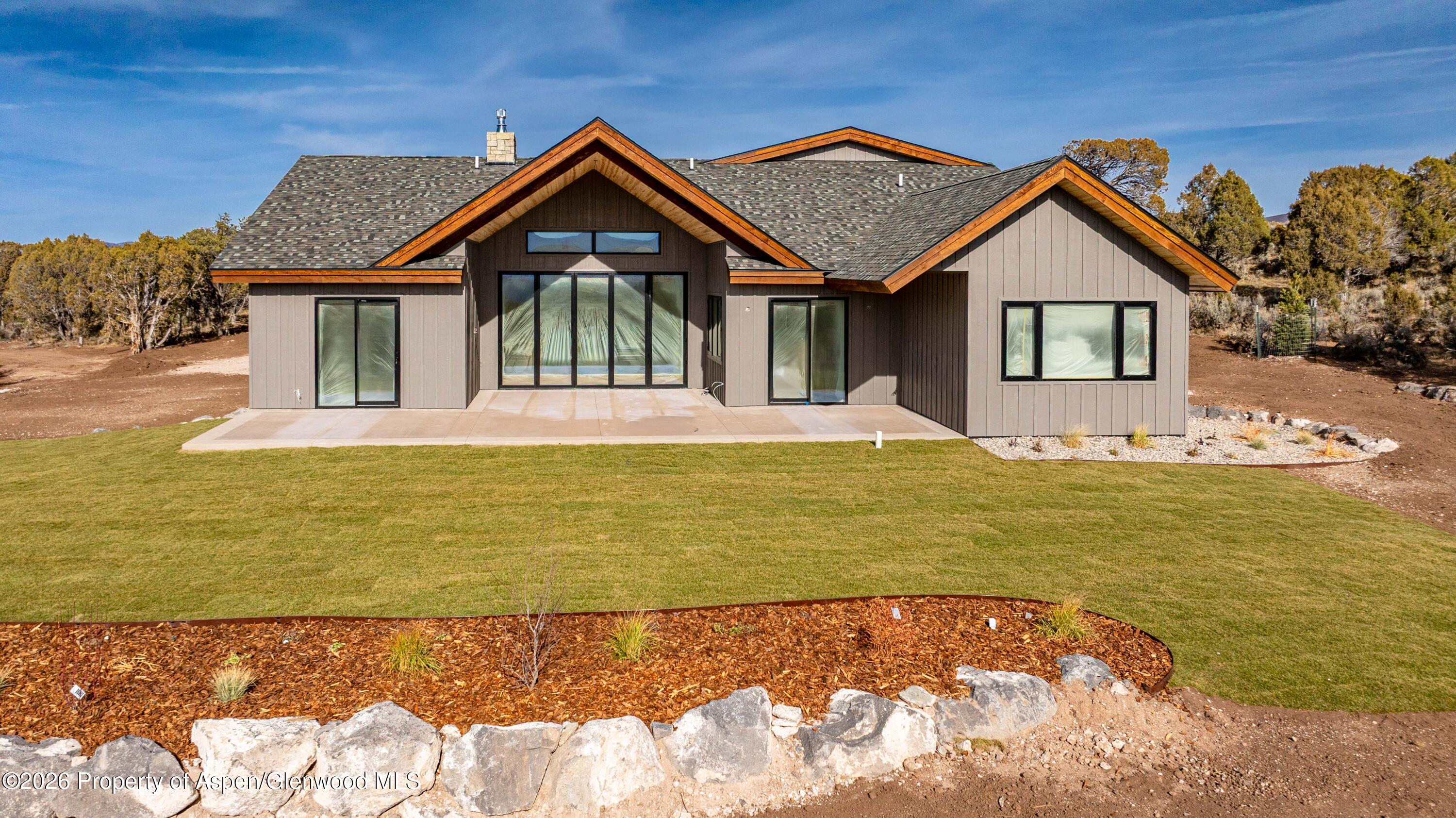 38 Woodruff Road Glenwood Springs, CO 81601 - Photo 32 of 34 a front view of a house with a yard