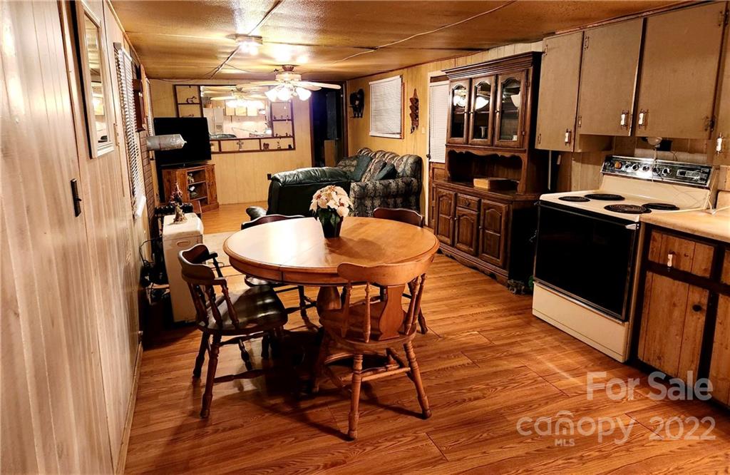 541 Incinerator Road Clyde, NC 28721 - Photo 3 of 11 a view of a dining room with furniture window and wooden floor