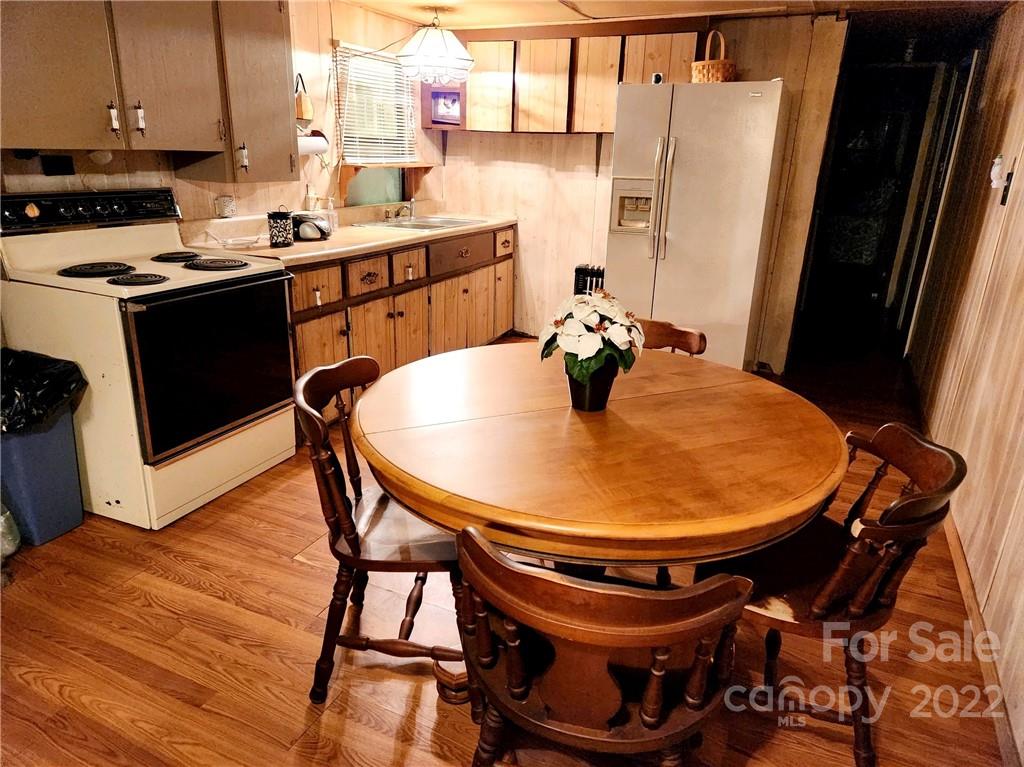 541 Incinerator Road Clyde, NC 28721 - Photo 4 of 11 a table and chairs in a kitchen