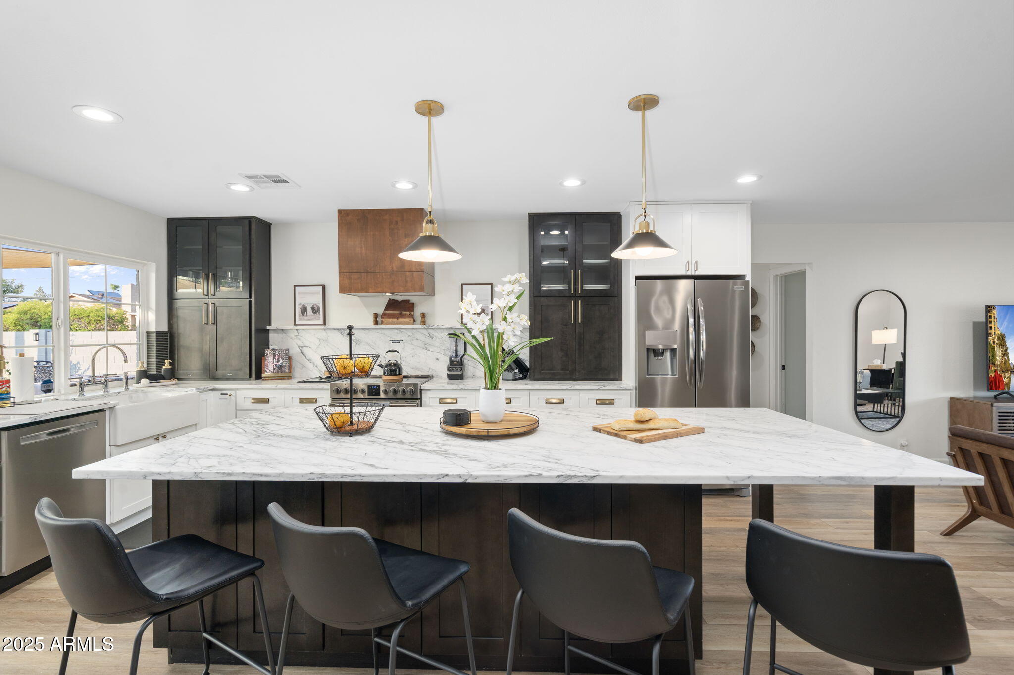 5142 East Nisbet Road Scottsdale, AZ 85254 - Photo 11 of 54 a kitchen with a dining table chairs and refrigerator