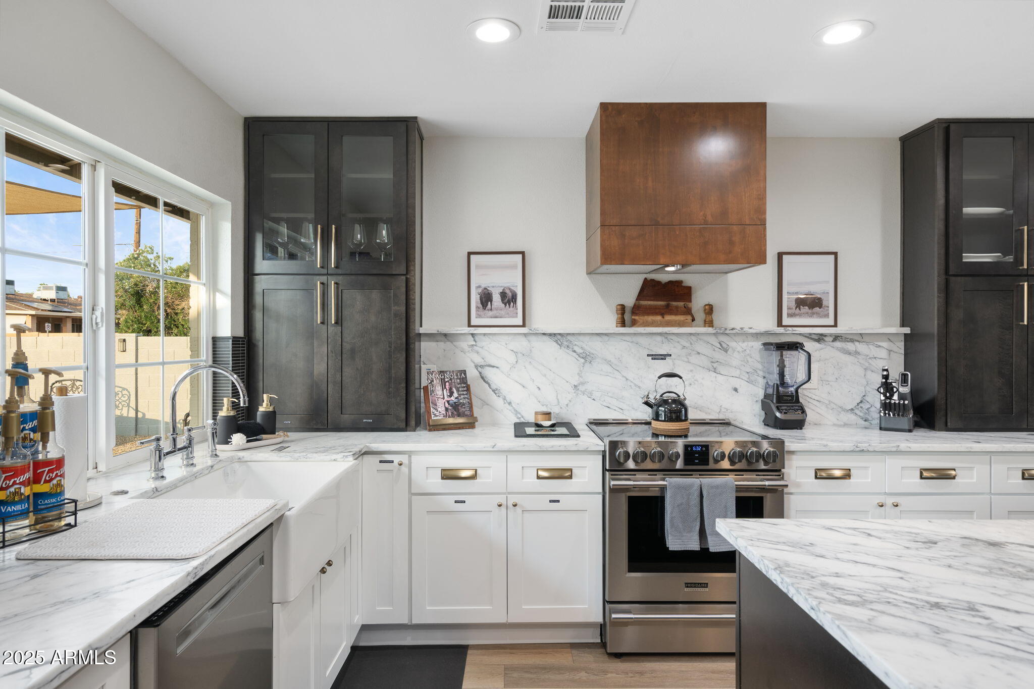 5142 East Nisbet Road Scottsdale, AZ 85254 - Photo 12 of 54 a kitchen with a sink stove and cabinets
