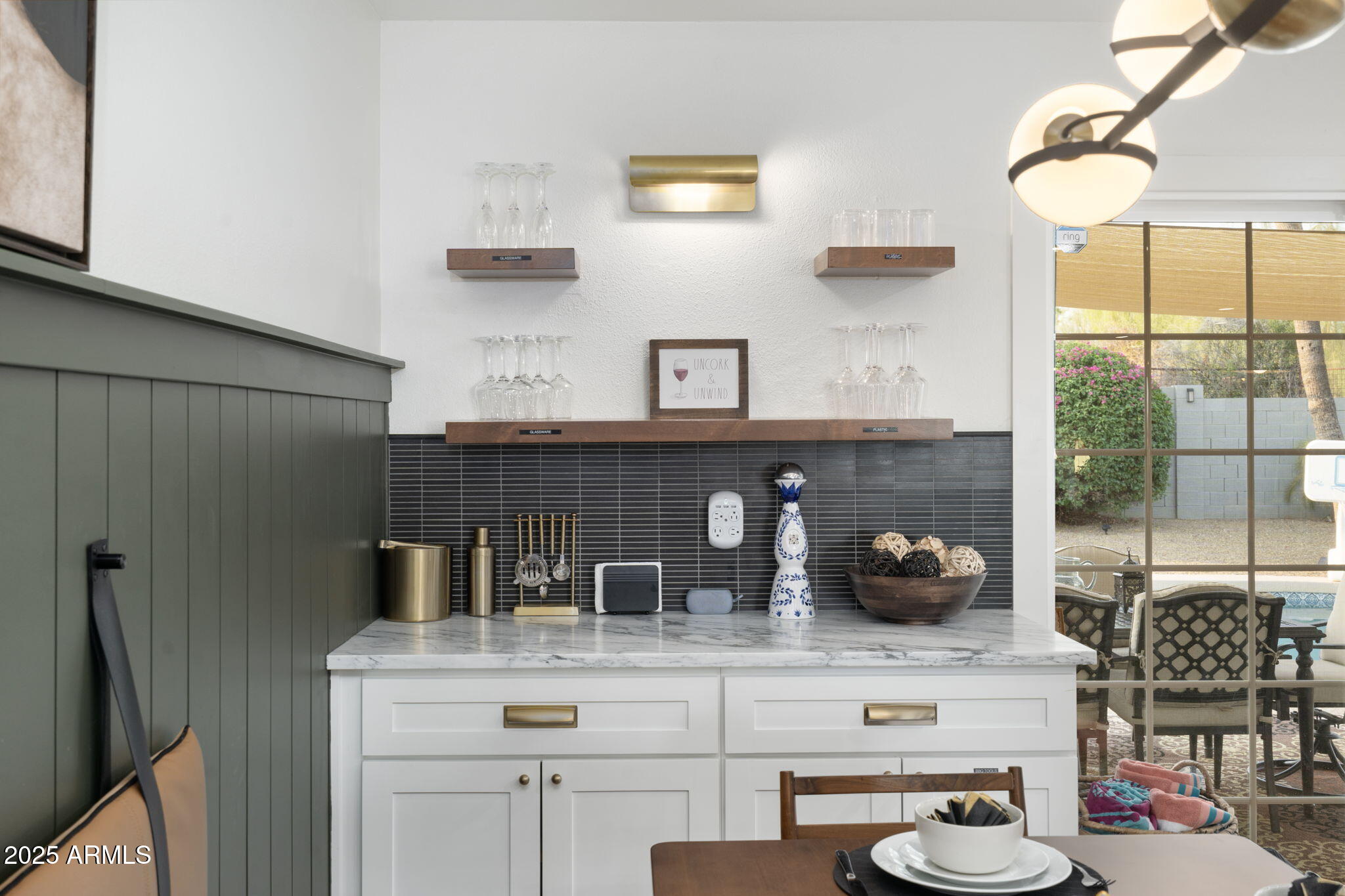 5142 East Nisbet Road Scottsdale, AZ 85254 - Photo 16 of 54 a kitchen with a refrigerator and a potted plant