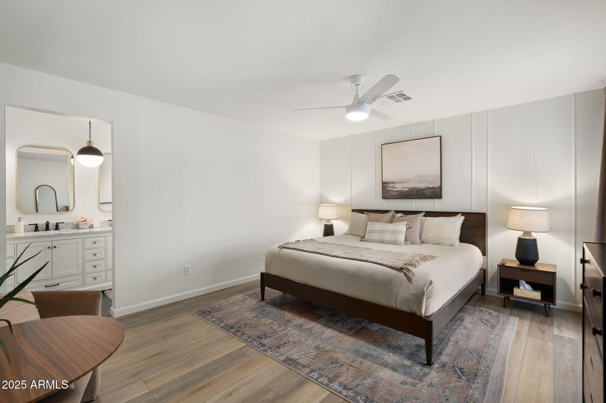 5142 East Nisbet Road Scottsdale, AZ 85254 - Photo 17 of 54 a bedroom with a bed and a couch