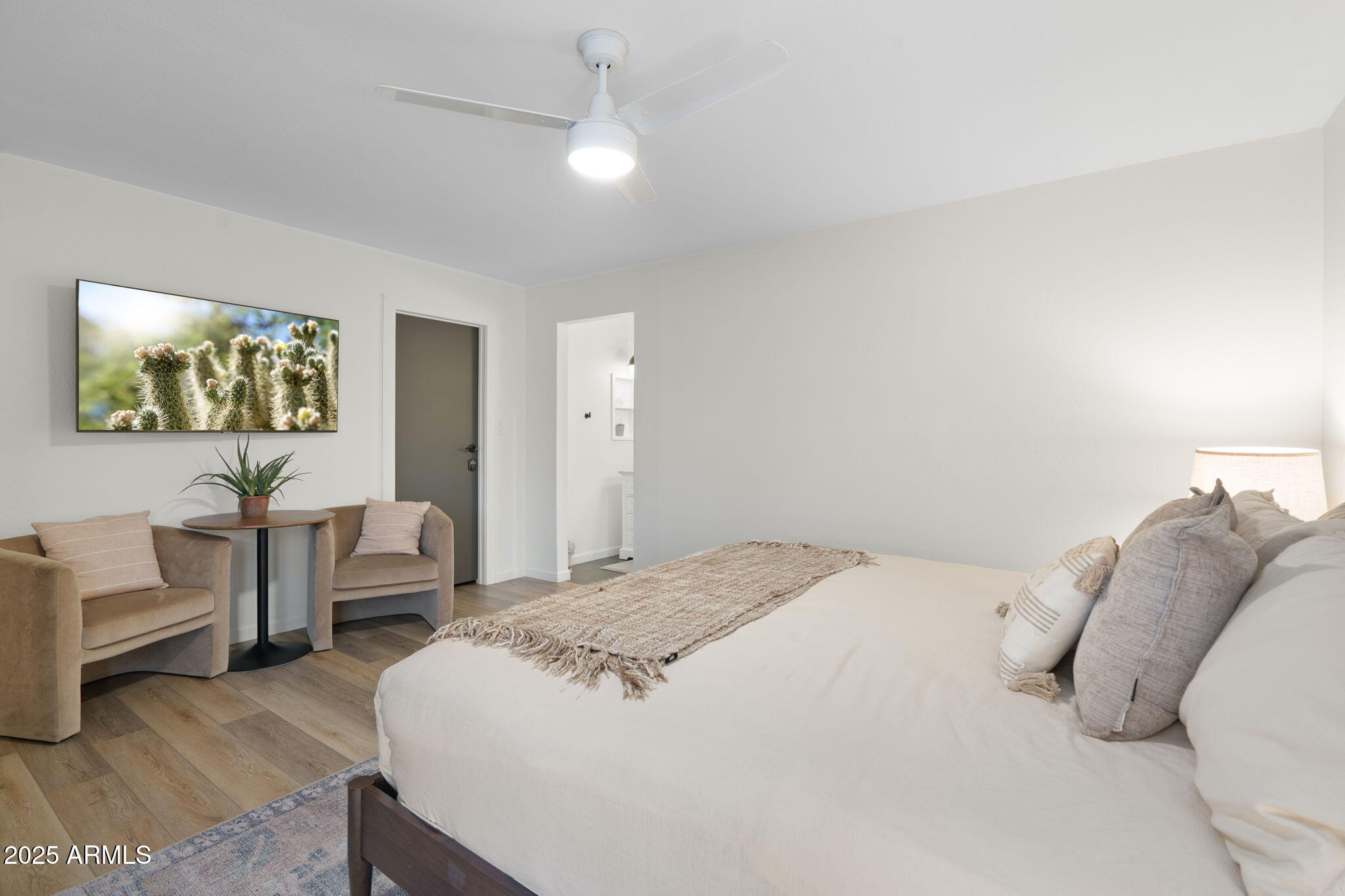 5142 East Nisbet Road Scottsdale, AZ 85254 - Photo 25 of 54 a bedroom with a bed and a chandelier