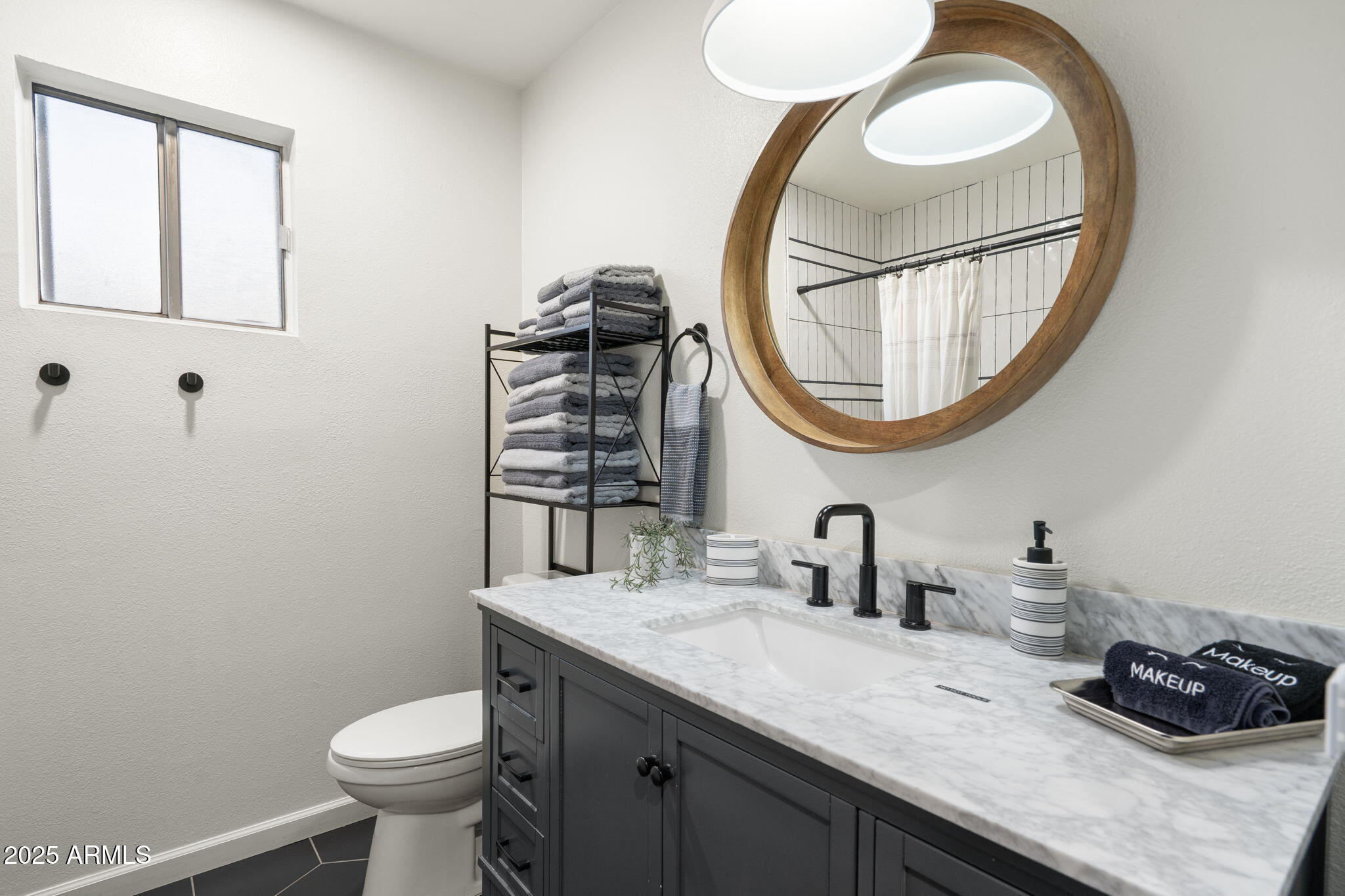 5142 East Nisbet Road Scottsdale, AZ 85254 - Photo 26 of 54 a bathroom with a granite countertop sink and a mirror