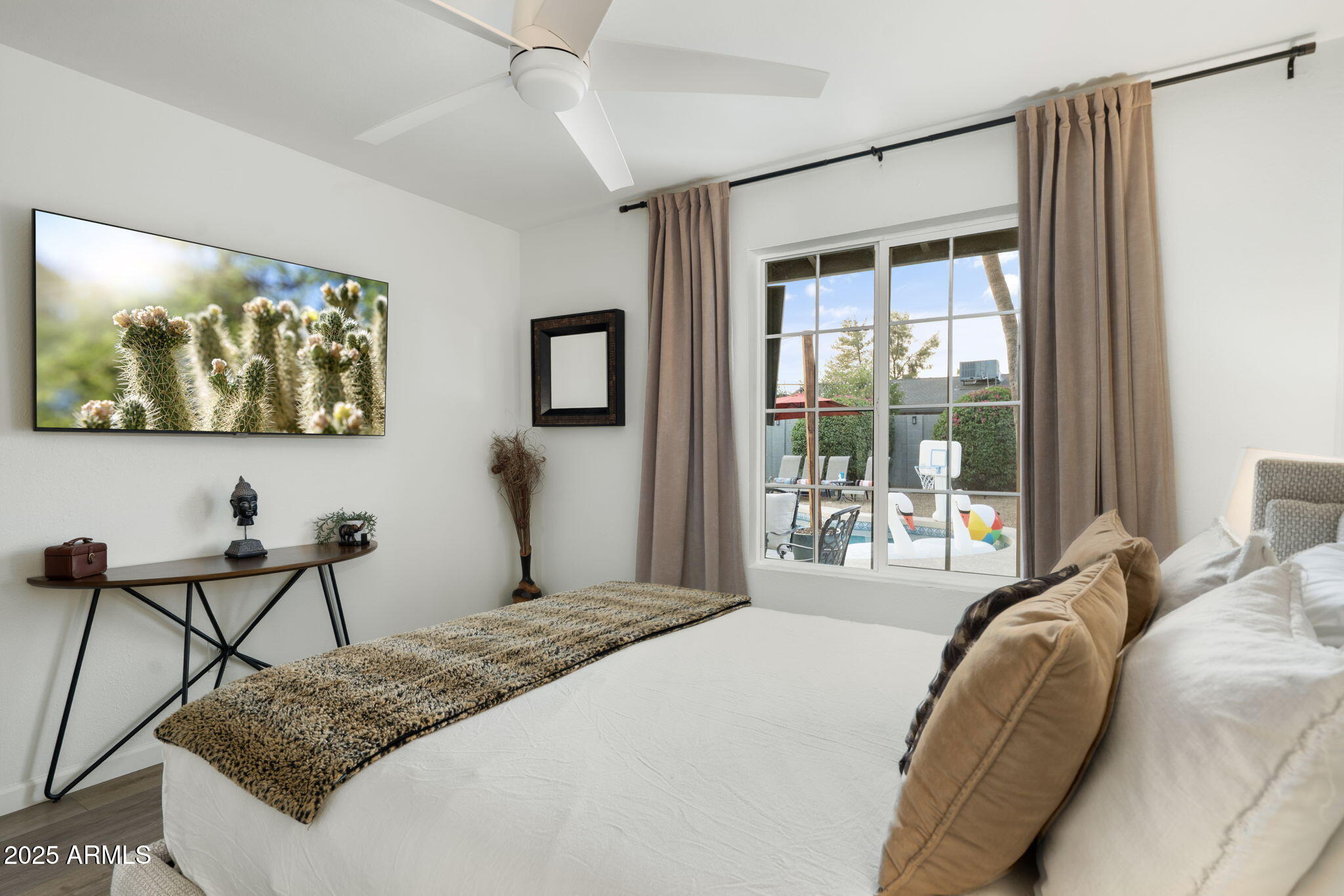 5142 East Nisbet Road Scottsdale, AZ 85254 - Photo 32 of 54 a bedroom with a bed and a window