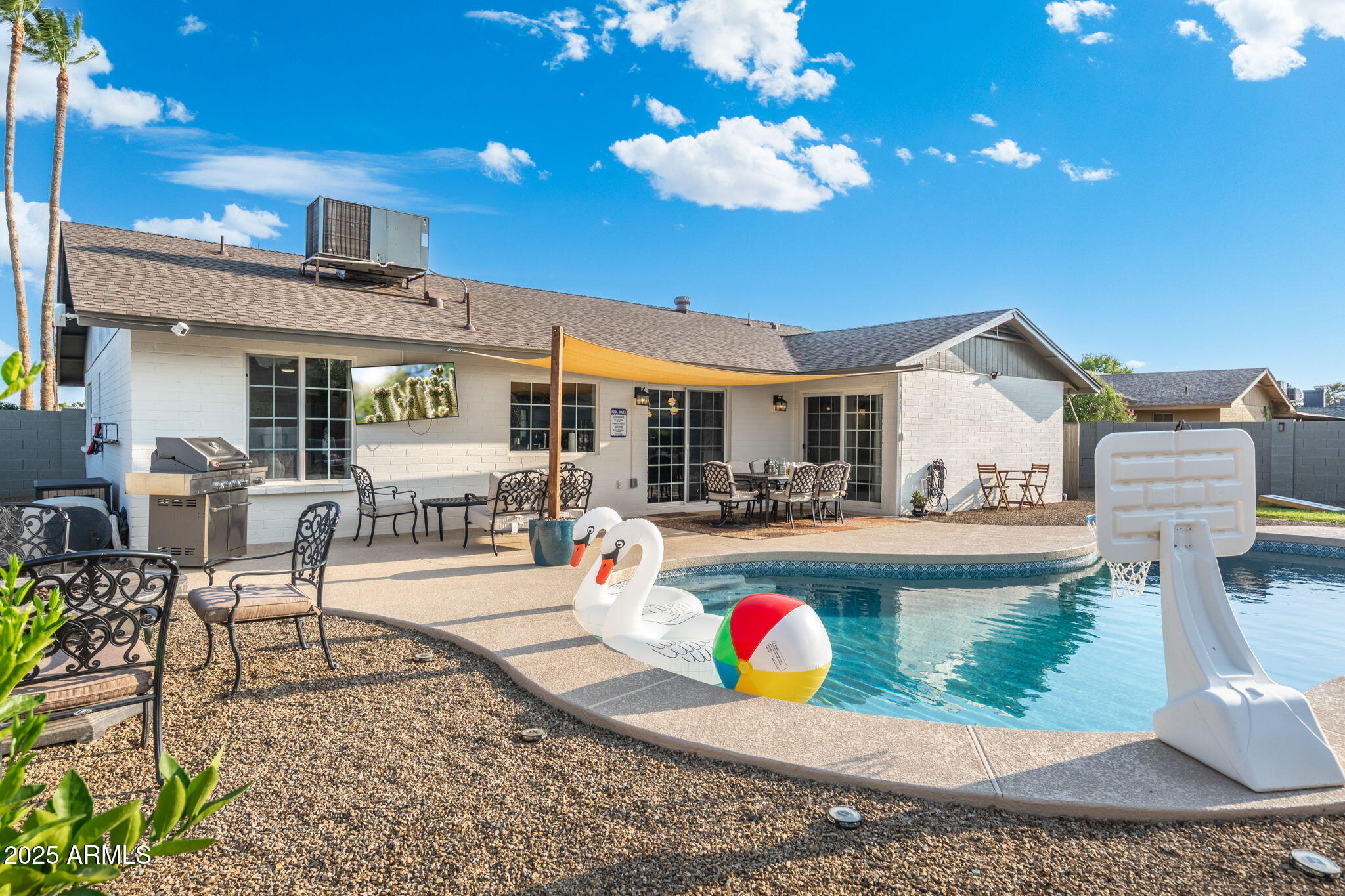 5142 East Nisbet Road Scottsdale, AZ 85254 - Photo 40 of 54 a view of a house with swimming pool and sitting area