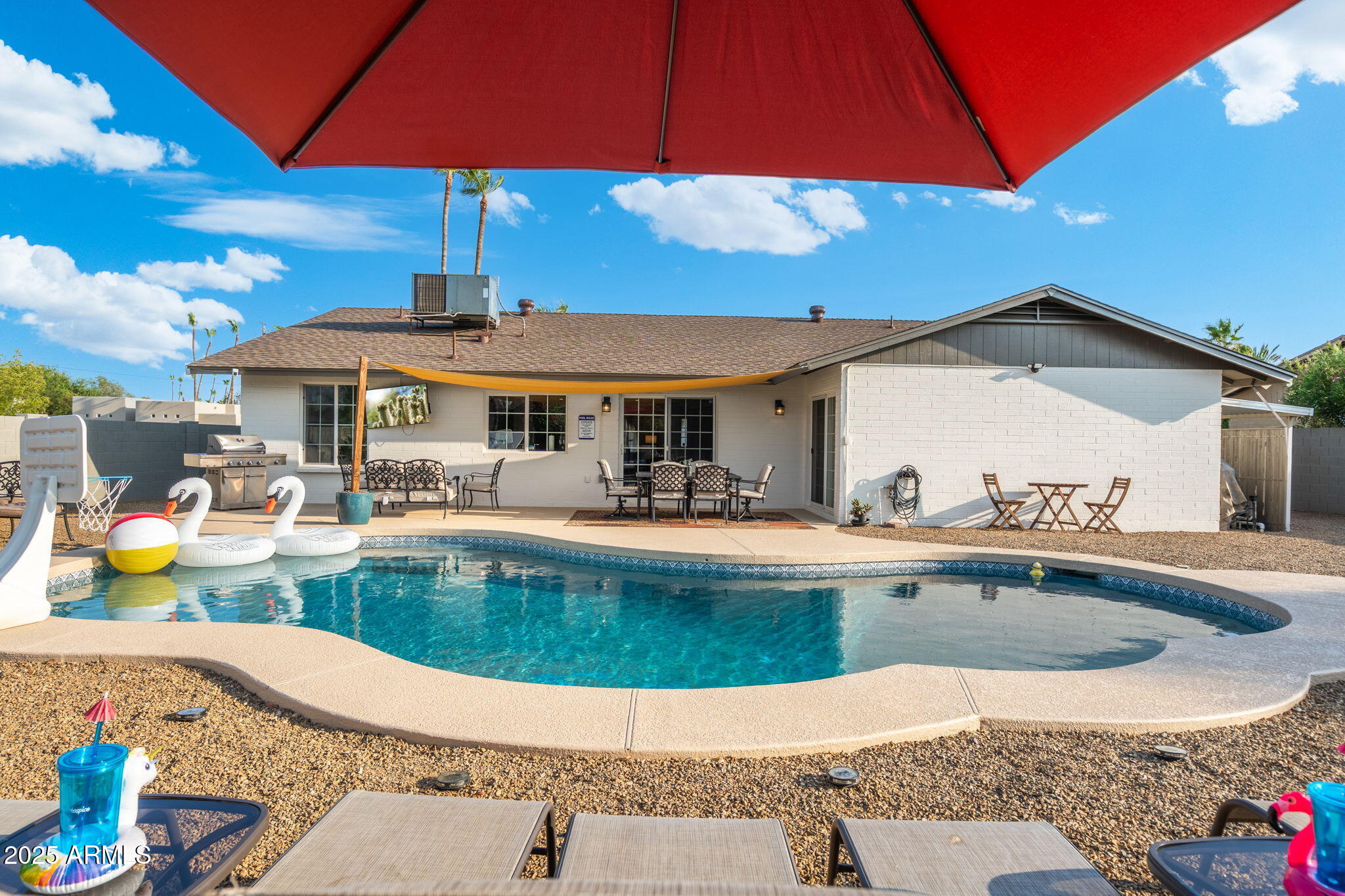 5142 East Nisbet Road Scottsdale, AZ 85254 - Photo 41 of 54 a view of a patio with swimming pool table and chairs