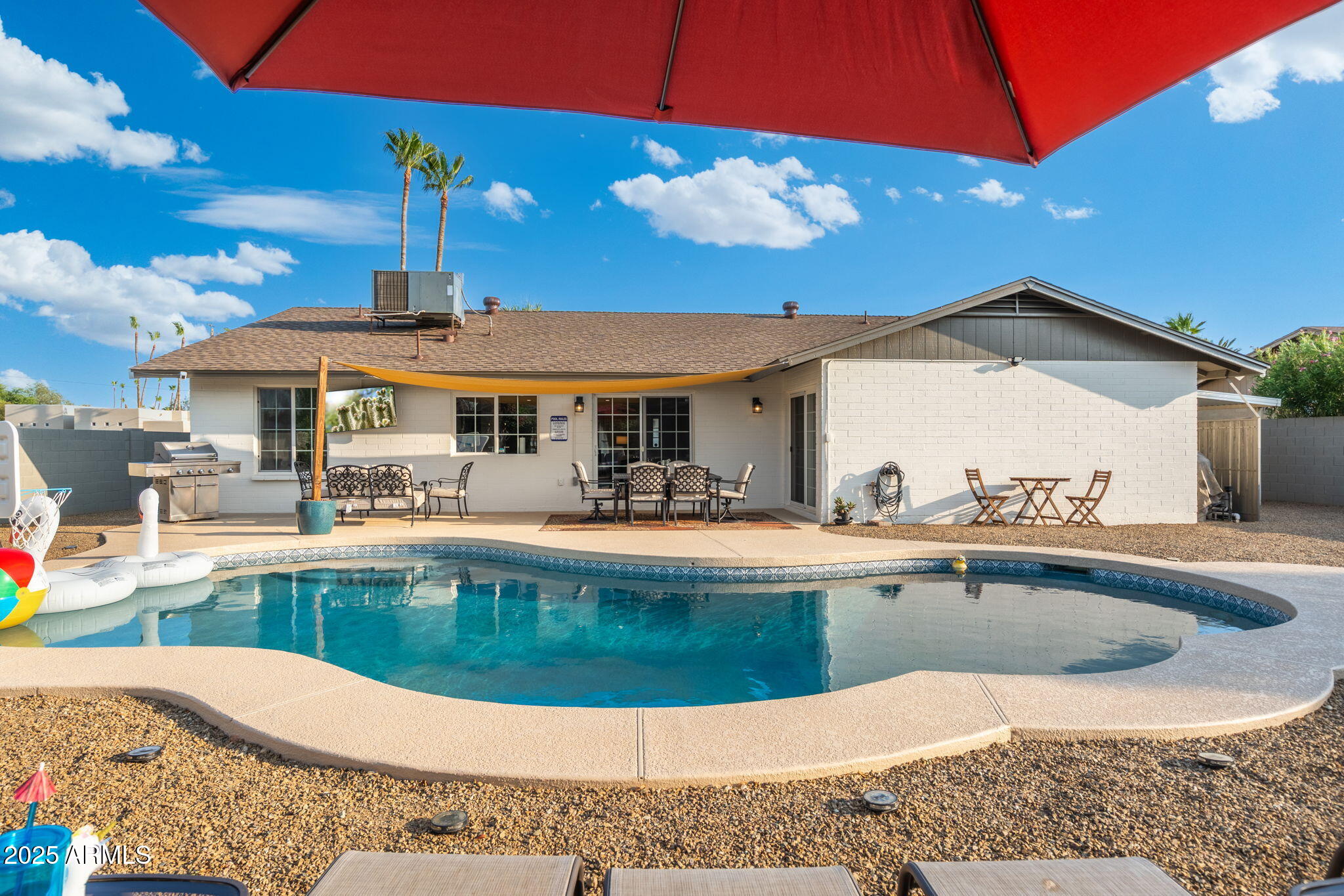 5142 East Nisbet Road Scottsdale, AZ 85254 - Photo 44 of 54 a view of a swimming pool with a patio