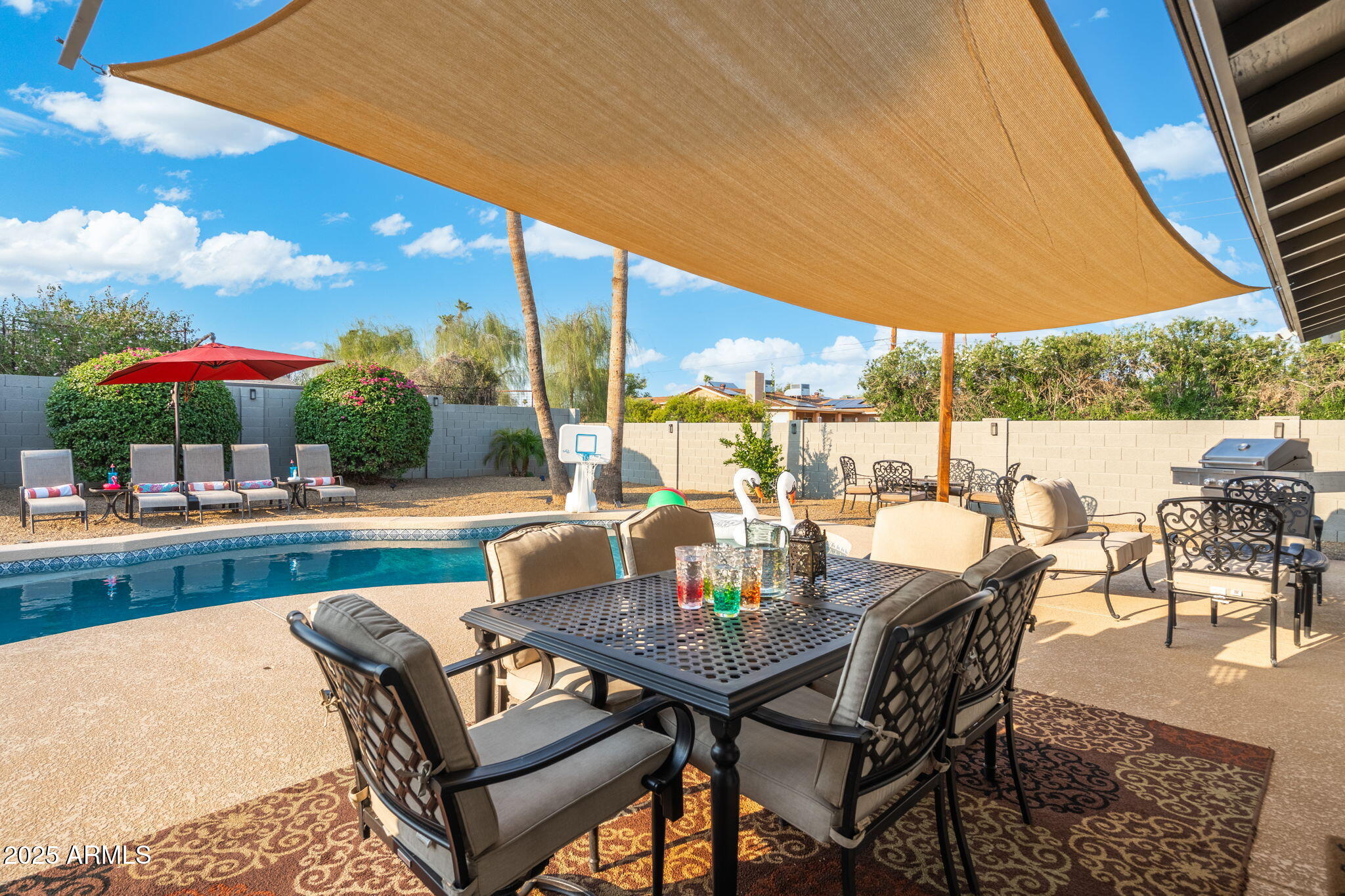 5142 East Nisbet Road Scottsdale, AZ 85254 - Photo 47 of 54 a view of an outdoor sitting area with furniture and umbrella
