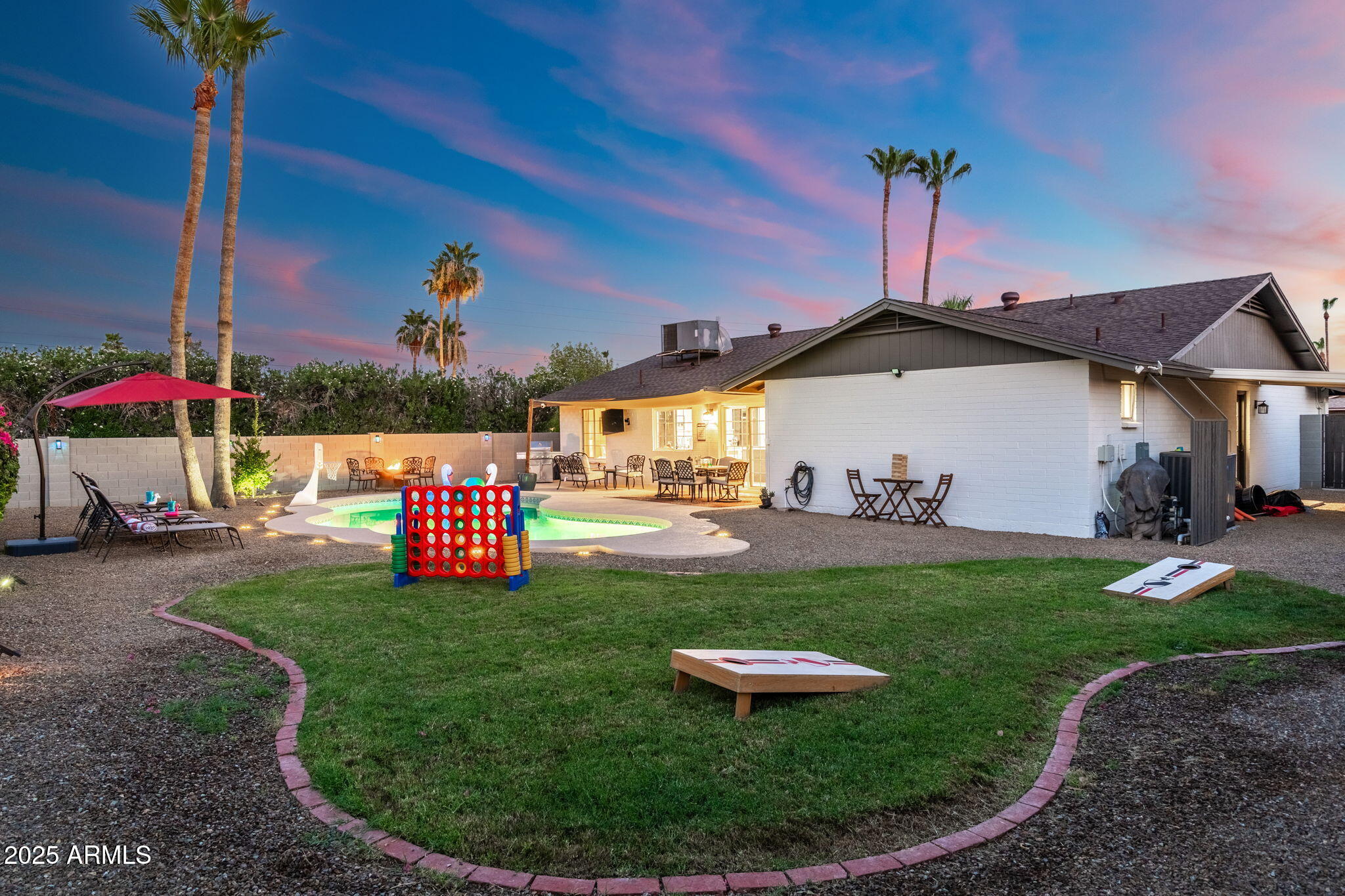 5142 East Nisbet Road Scottsdale, AZ 85254 - Photo 49 of 54 a view of a house with a backyard and sitting area