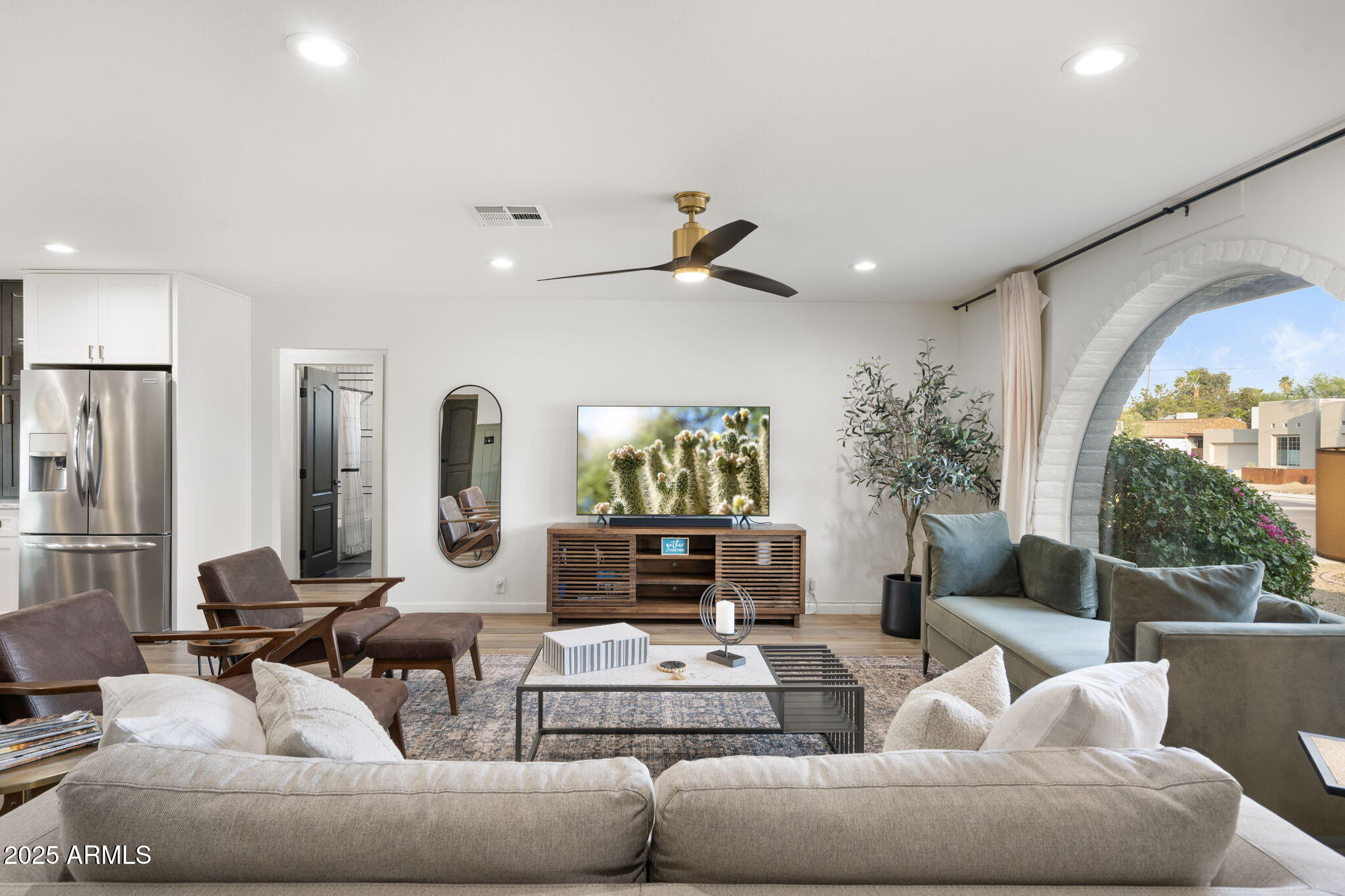 5142 East Nisbet Road Scottsdale, AZ 85254 - Photo 5 of 54 a living room with furniture and a flat screen tv