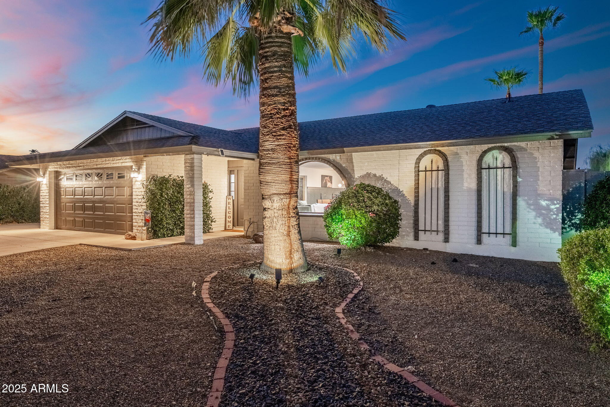 5142 East Nisbet Road Scottsdale, AZ 85254 - Photo 53 of 54 a front view of a house with garden