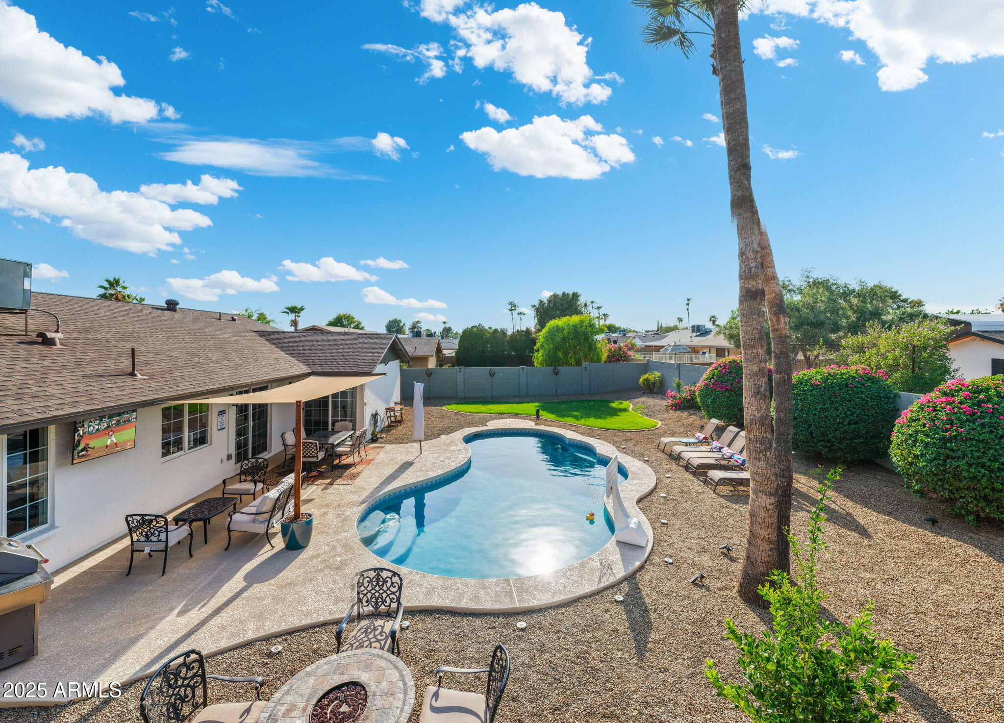 5142 East Nisbet Road Scottsdale, AZ 85254 - Photo 54 of 54 a swimming pool with outdoor seating and yard