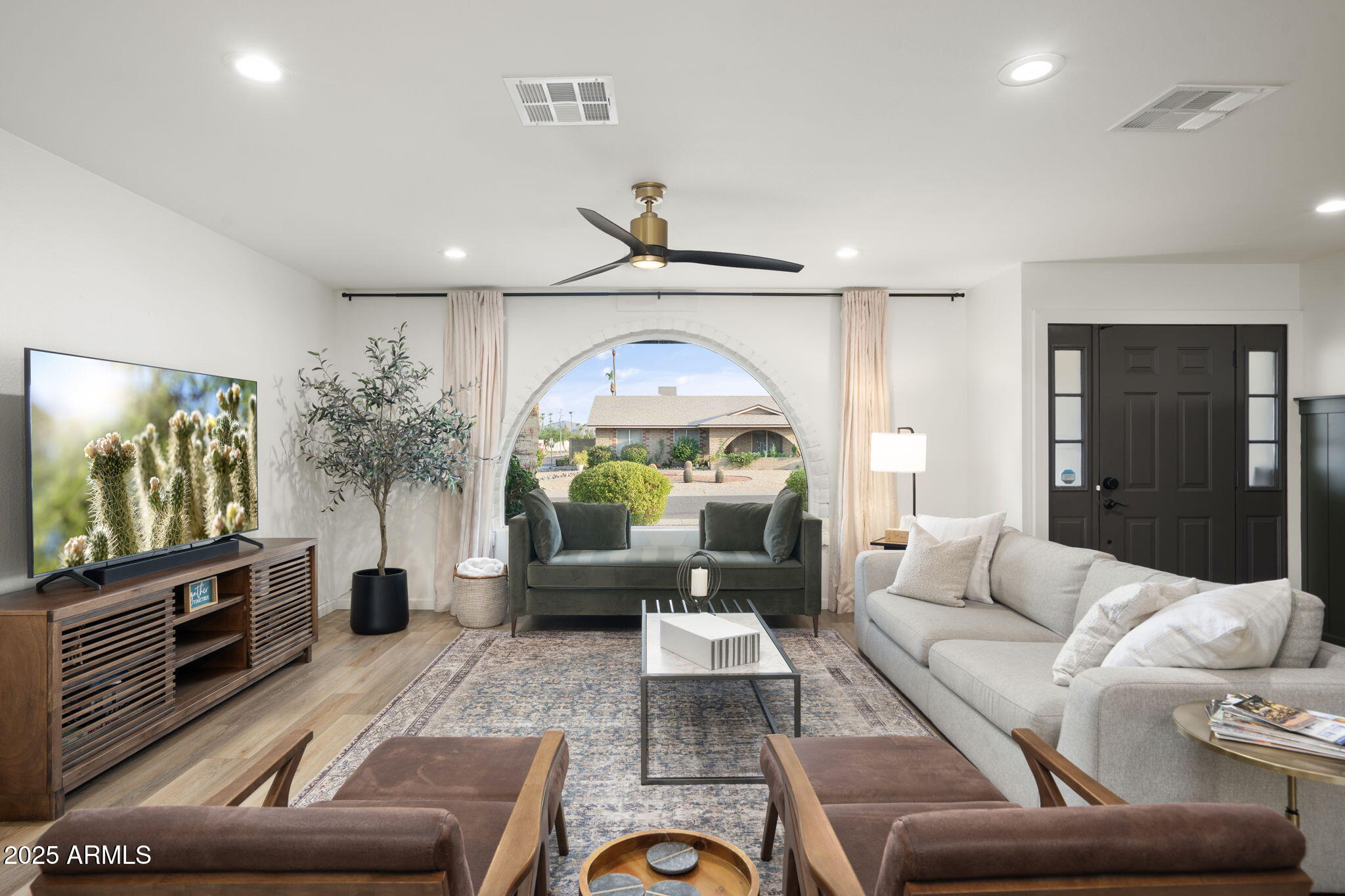 5142 East Nisbet Road Scottsdale, AZ 85254 - Photo 6 of 54 a living room with furniture and a flat screen tv