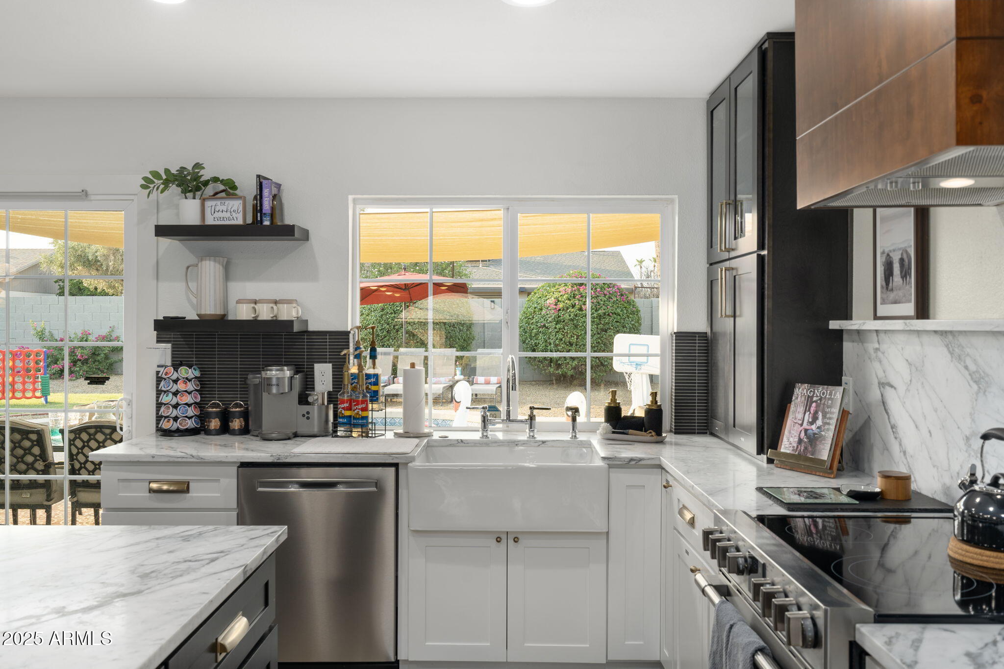 5142 East Nisbet Road Scottsdale, AZ 85254 - Photo 8 of 54 a kitchen with a sink stove and cabinets