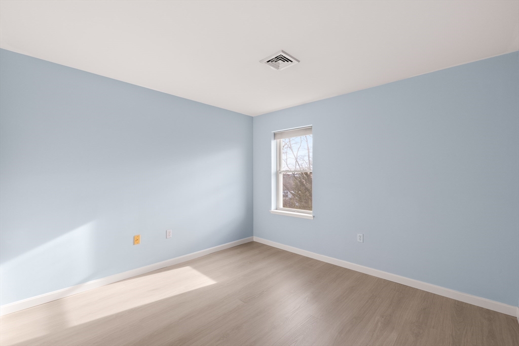 30 Franklin Street, Unit 314 Malden, MA 02148 - Photo 17 of 28 a view of an empty room with a window