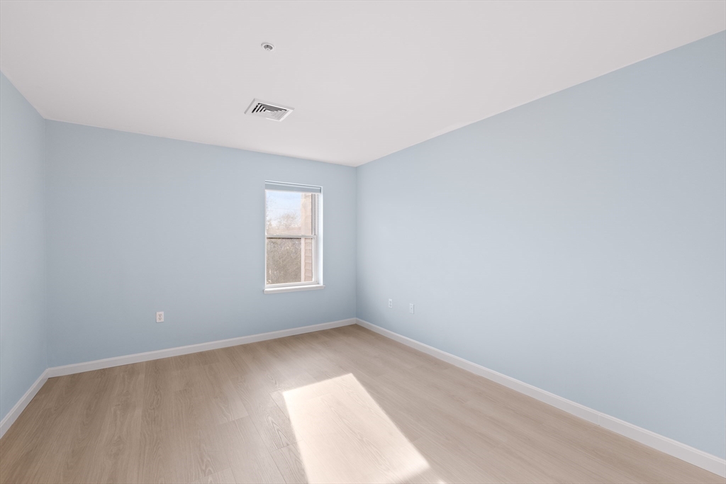 30 Franklin Street, Unit 314 Malden, MA 02148 - Photo 18 of 28 a view of an empty room with a window
