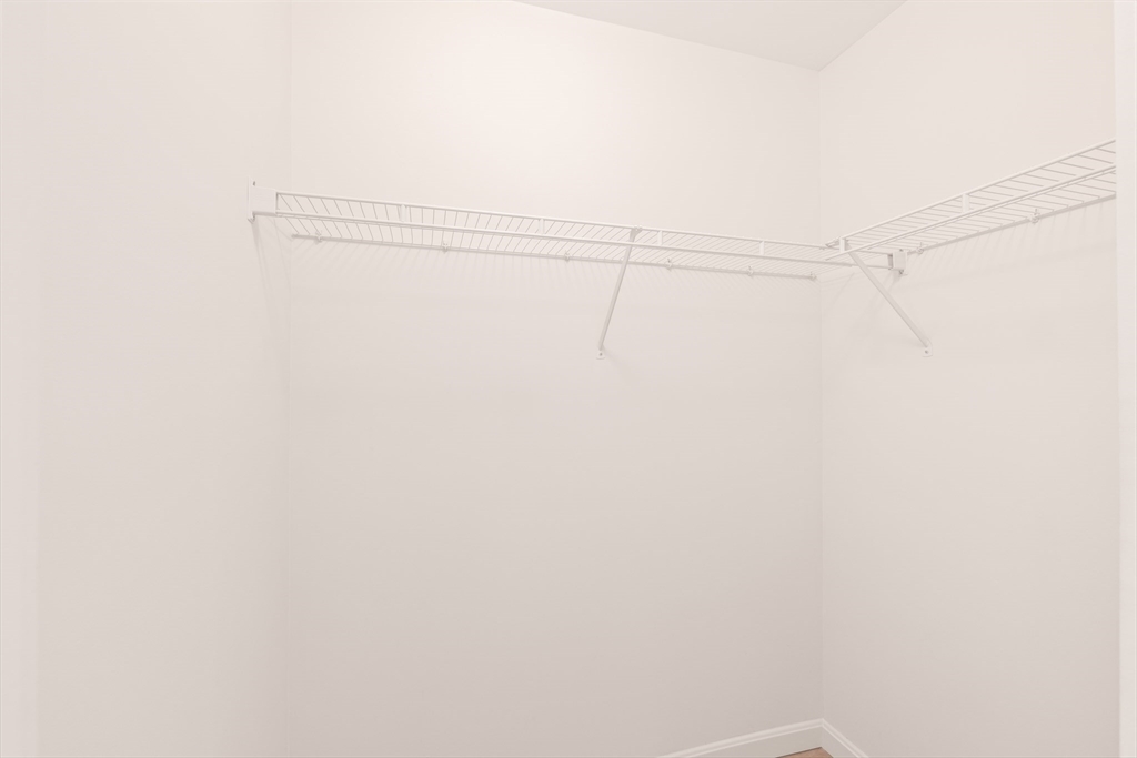 30 Franklin Street, Unit 314 Malden, MA 02148 - Photo 21 of 28 a view of a room with racks on the wall