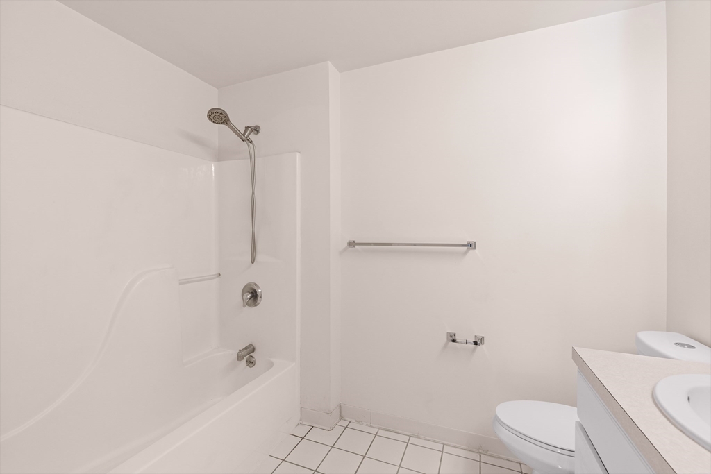 30 Franklin Street, Unit 314 Malden, MA 02148 - Photo 24 of 28 a bathroom with a sink a toilet and shower