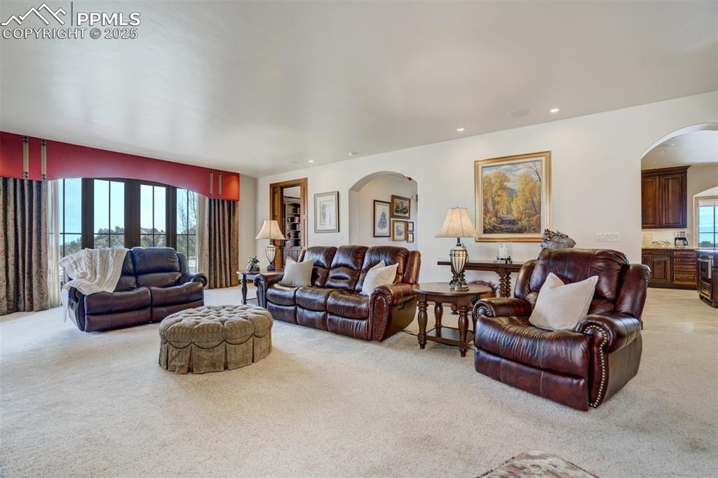 14250 Aiken Ride View Colorado Springs, CO 80926 - Photo 13 of 50 a living room with furniture and a large window