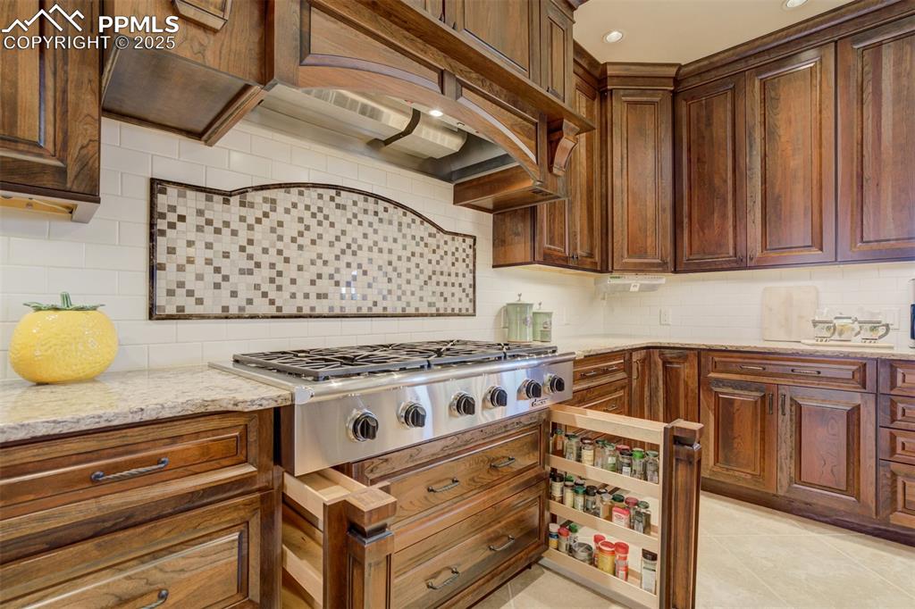 14250 Aiken Ride View Colorado Springs, CO 80926 - Photo 19 of 50 a white stove top oven sitting inside of a kitchen