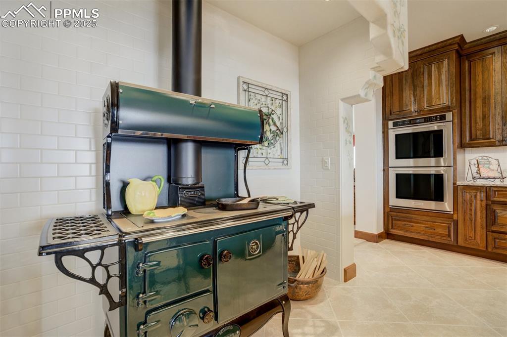 14250 Aiken Ride View Colorado Springs, CO 80926 - Photo 21 of 50 a stove top oven sitting inside of a kitchen