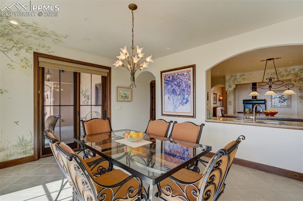 14250 Aiken Ride View Colorado Springs, CO 80926 - Photo 24 of 50 a dining room with furniture and window