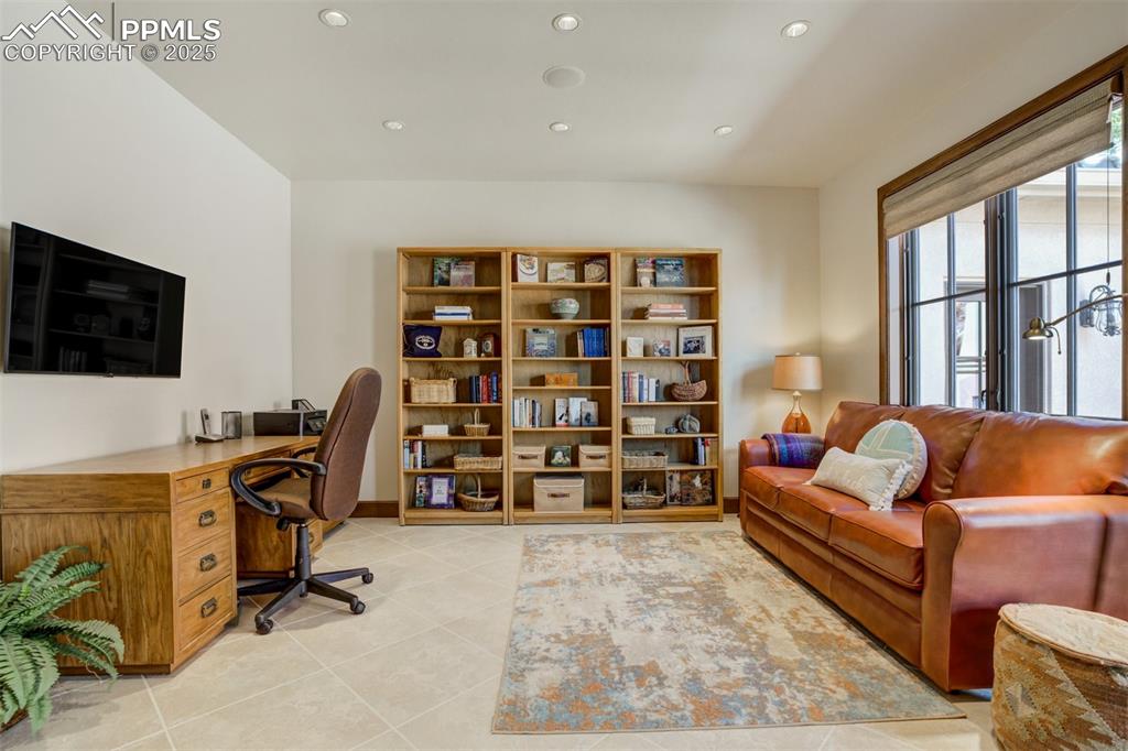 14250 Aiken Ride View Colorado Springs, CO 80926 - Photo 25 of 50 a view of a livingroom with workspace and a couch