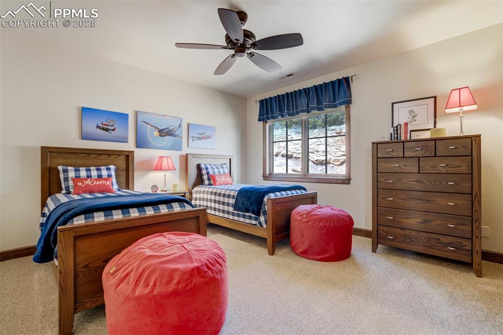 14250 Aiken Ride View Colorado Springs, CO 80926 - Photo 38 of 50 a bedroom with furniture and a ceiling fan