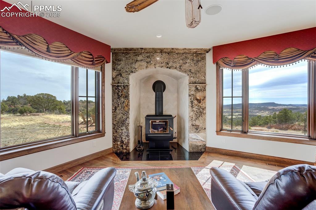 14250 Aiken Ride View Colorado Springs, CO 80926 - Photo 7 of 50 a living room with furniture and a floor to ceiling window