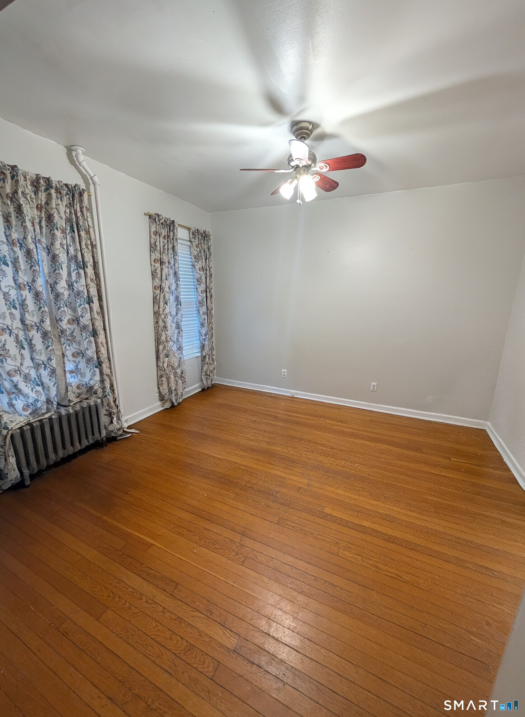 100 7th Street Norwich, CT 06360 - Photo 12 of 32 a view of a room with window and wooden floor