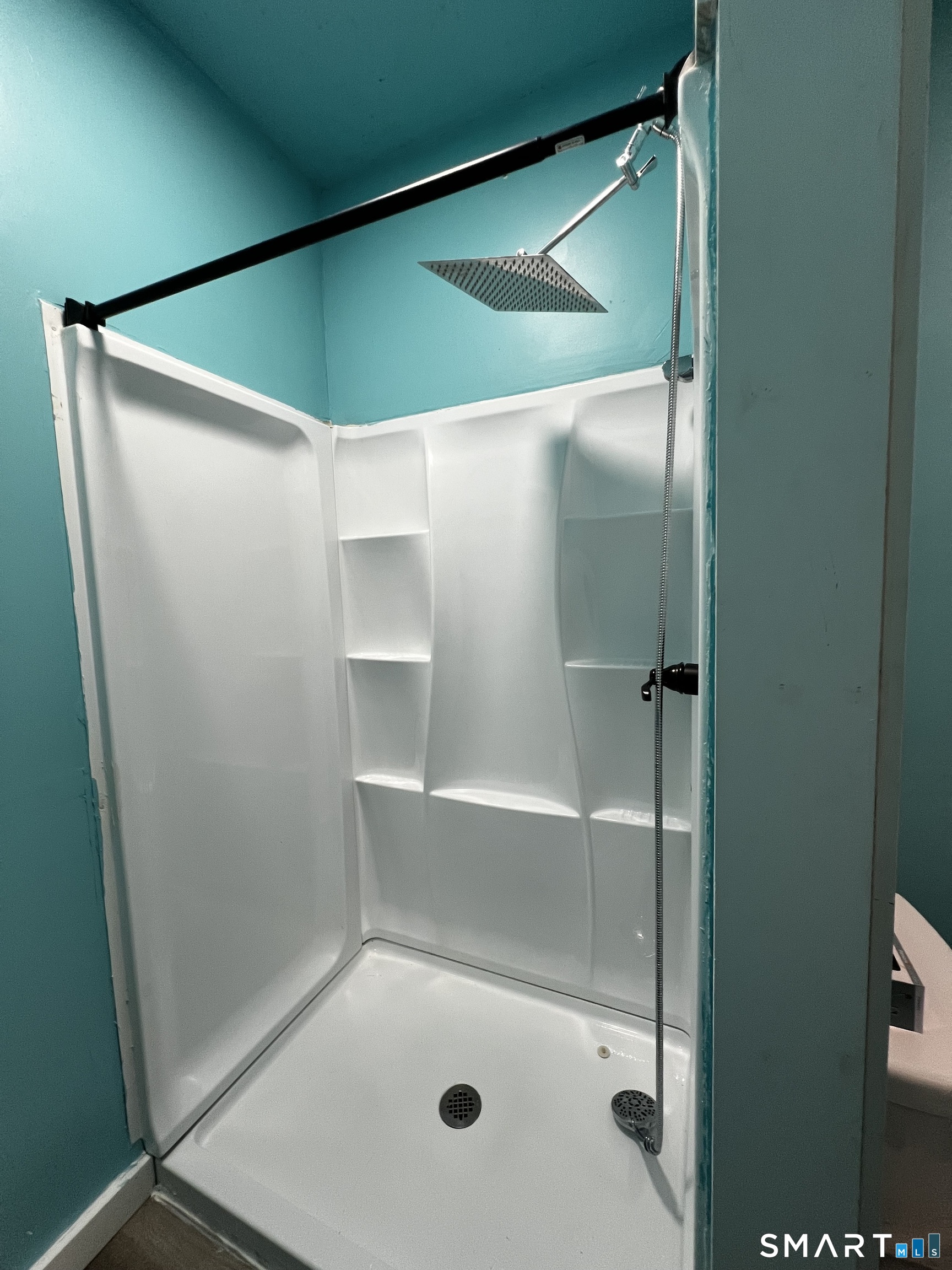 100 7th Street Norwich, CT 06360 - Photo 17 of 32 a bathroom with a glass shower door