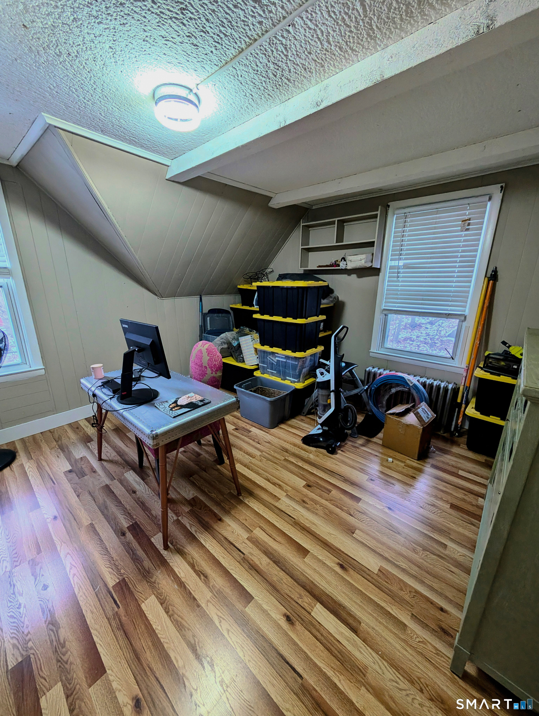 100 7th Street Norwich, CT 06360 - Photo 21 of 32 a living room with furniture and a wooden floor
