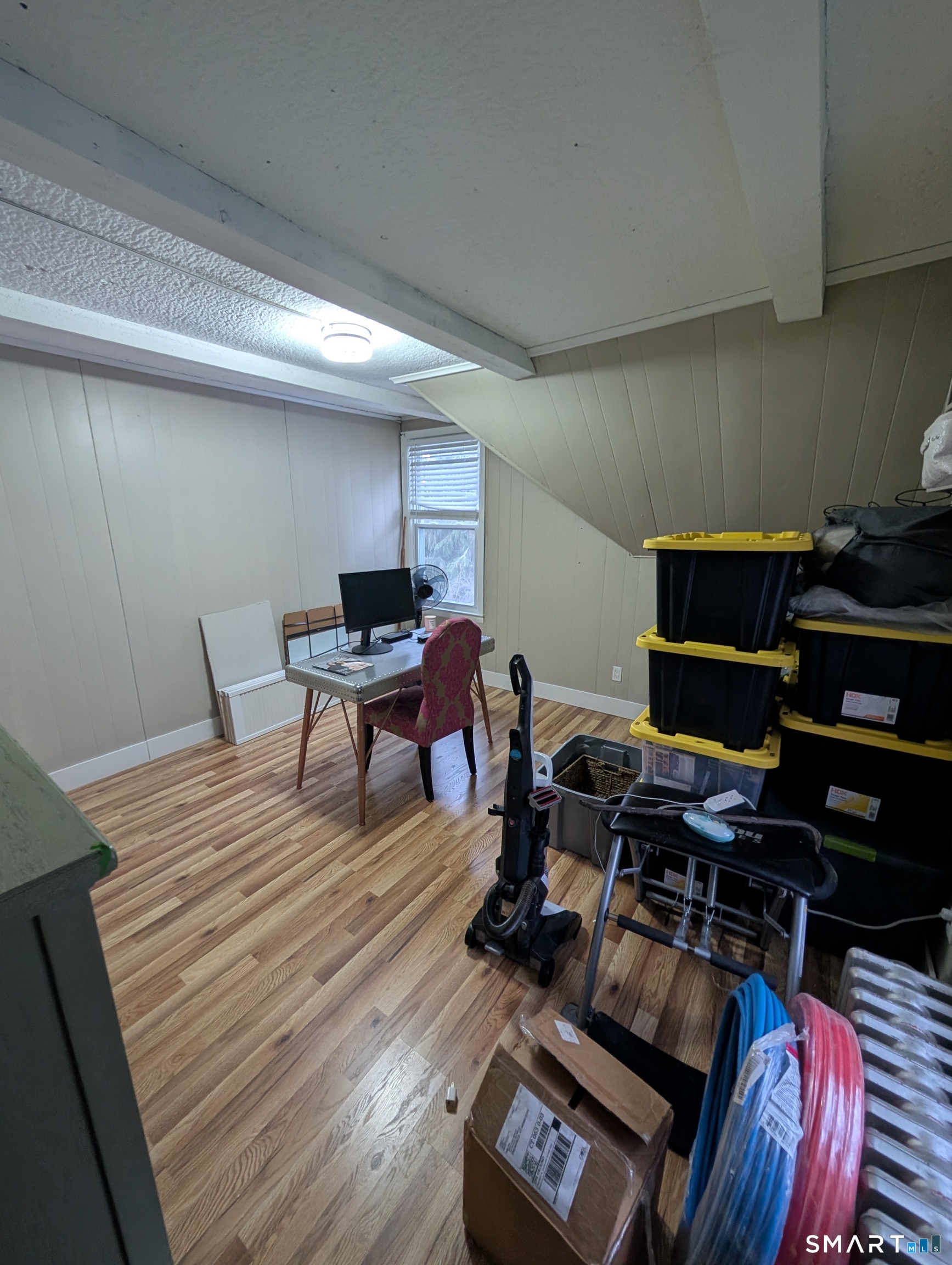 100 7th Street Norwich, CT 06360 - Photo 22 of 32 a workspace with furniture and wooden floor