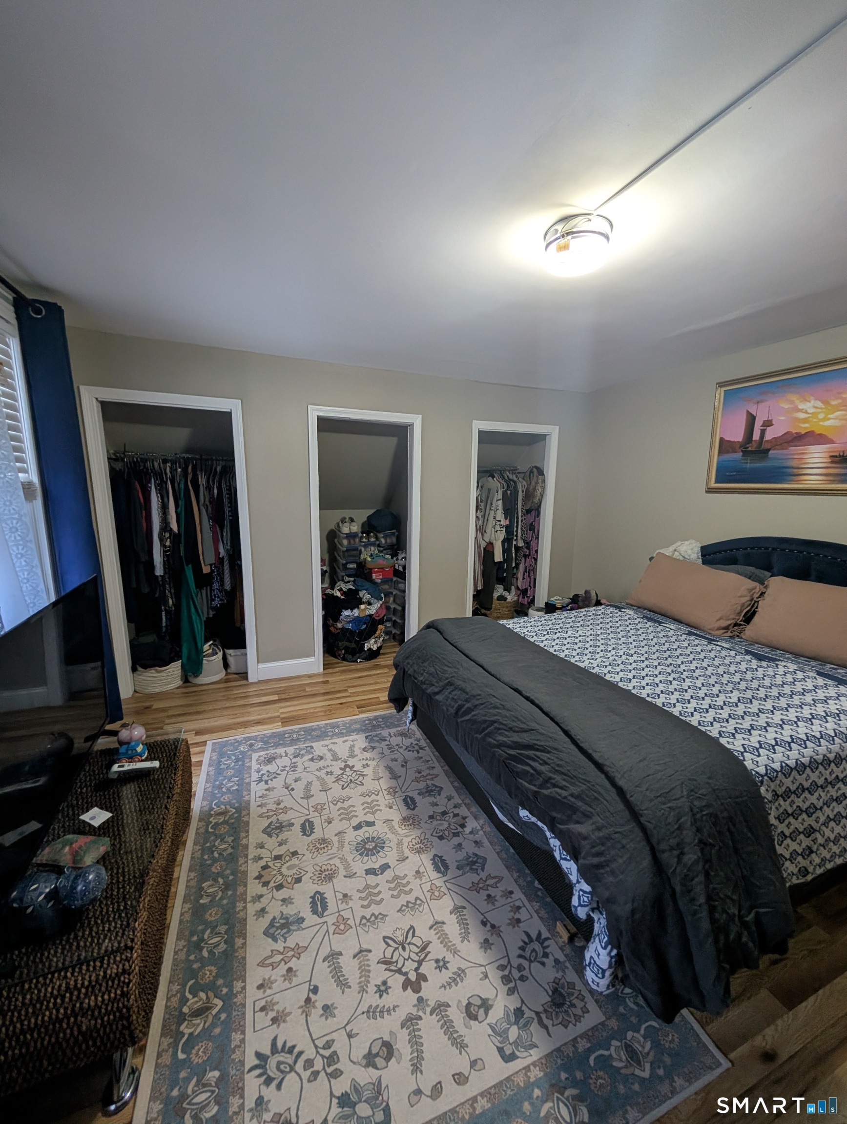 100 7th Street Norwich, CT 06360 - Photo 25 of 32 a bedroom with a bed and a mirror on dresser